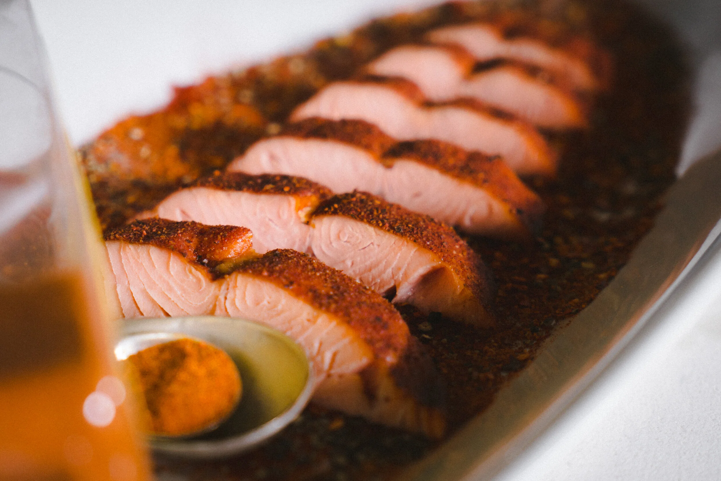 Artistic Shot of Expertly Prepared Row of Sliced Cajun Salmon