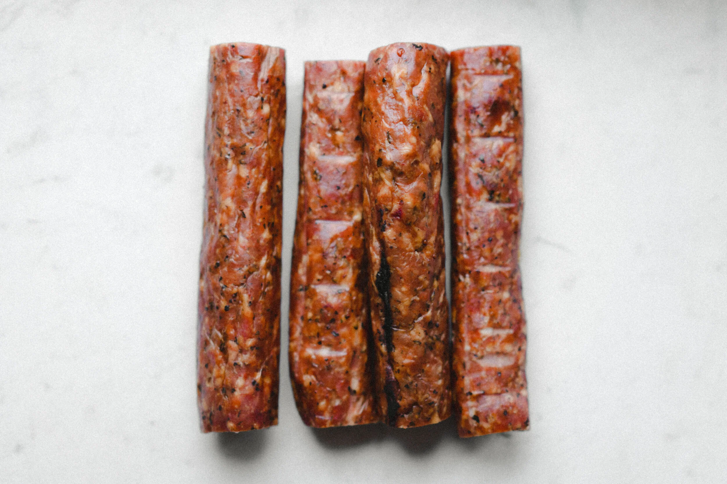 Photo of four andouille sticks