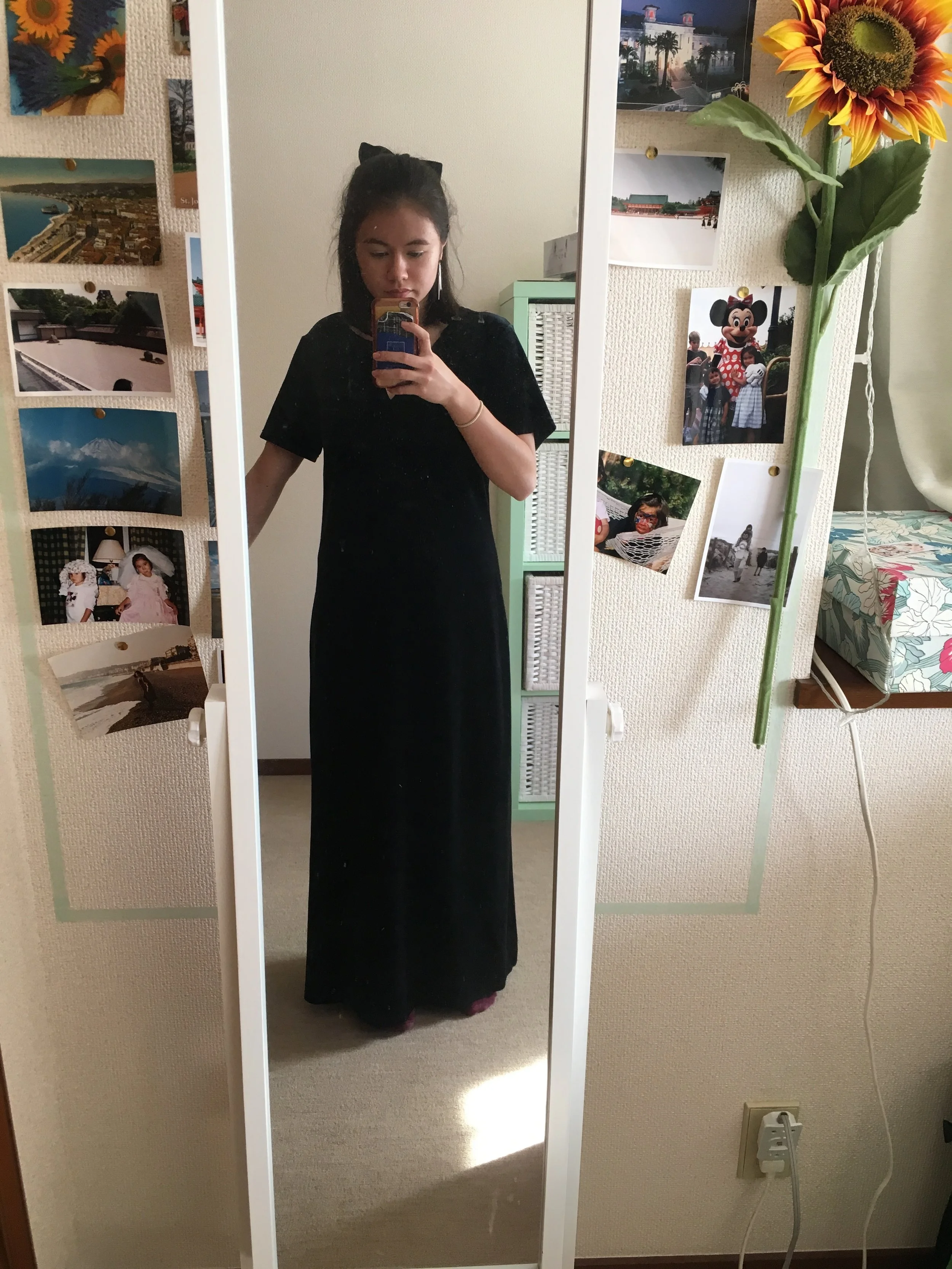 For this ball, I thrifted a long black velvet dress for £7.99. It was a size 14 and I altered it to be shorter, fit me better and lower the neckline by a lot. I broke an old bracelet I had and attached it to the dress with small gold eyelets to keep