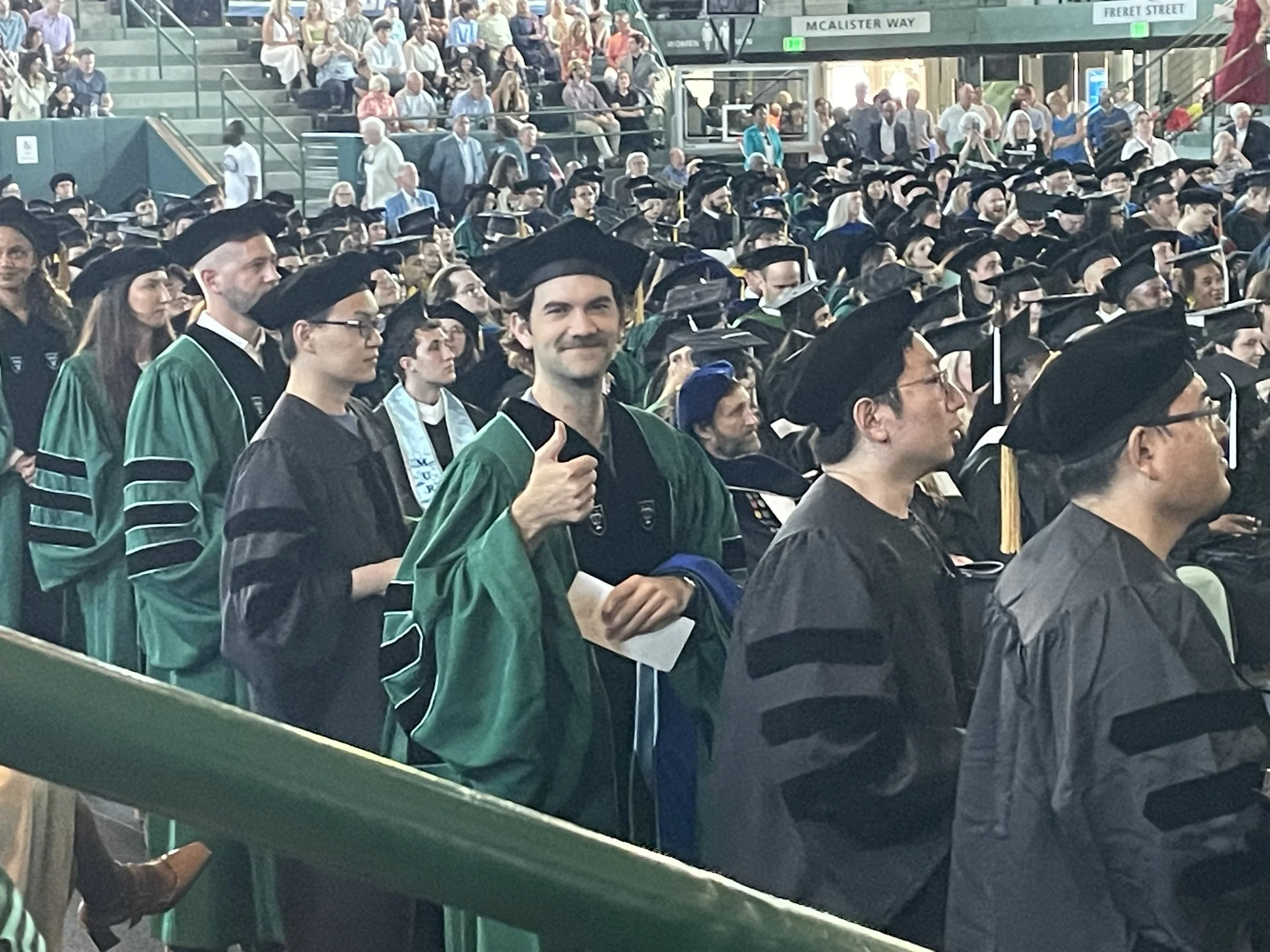  Parker Tirrell on his way to the stage at the Tulane PhD Hooding Ceremony held on May 14, 2026 
