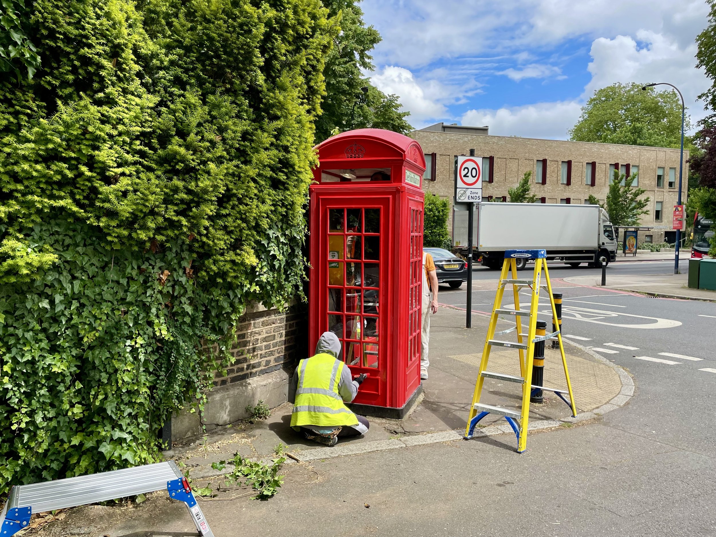 John (student) painting telephone box_Fri 14th June 2024_Photo A_by Lorna Jackson.jpeg