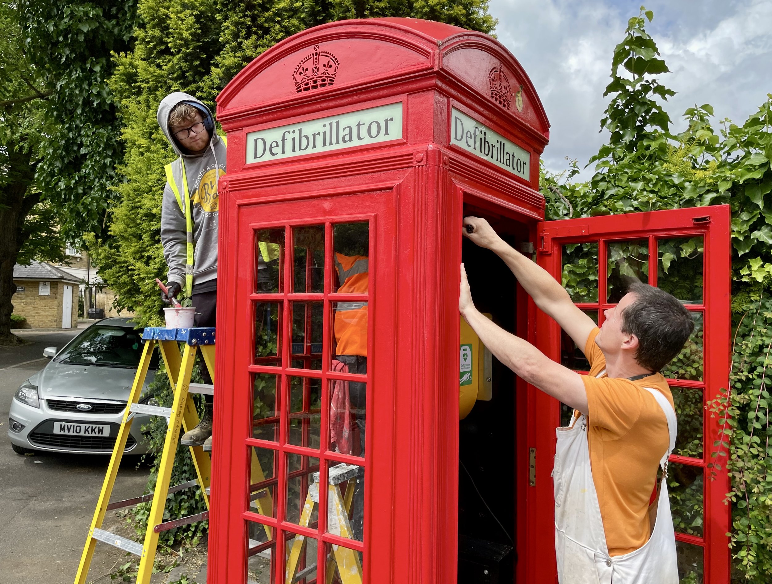 John (student) painting, Declan Egan (tutor) with & Kody (student) in phone box_Fri 14th June 2024.Photo by Lorna Jackson.jpeg
