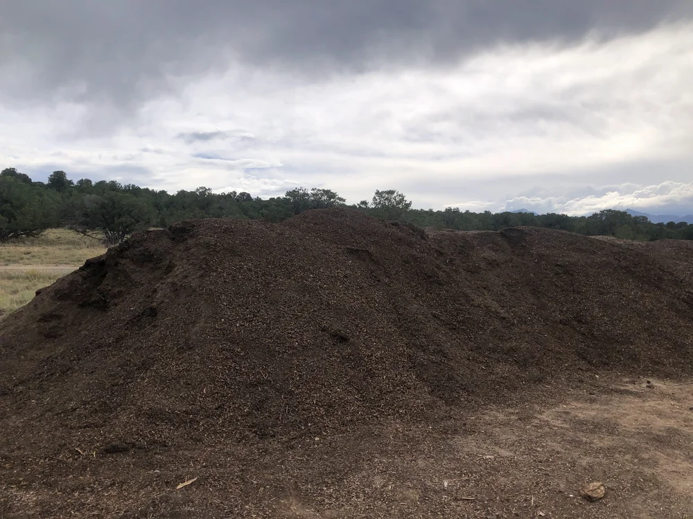 Finished compost pile, ready to be sold as soil to gardeners and farmers