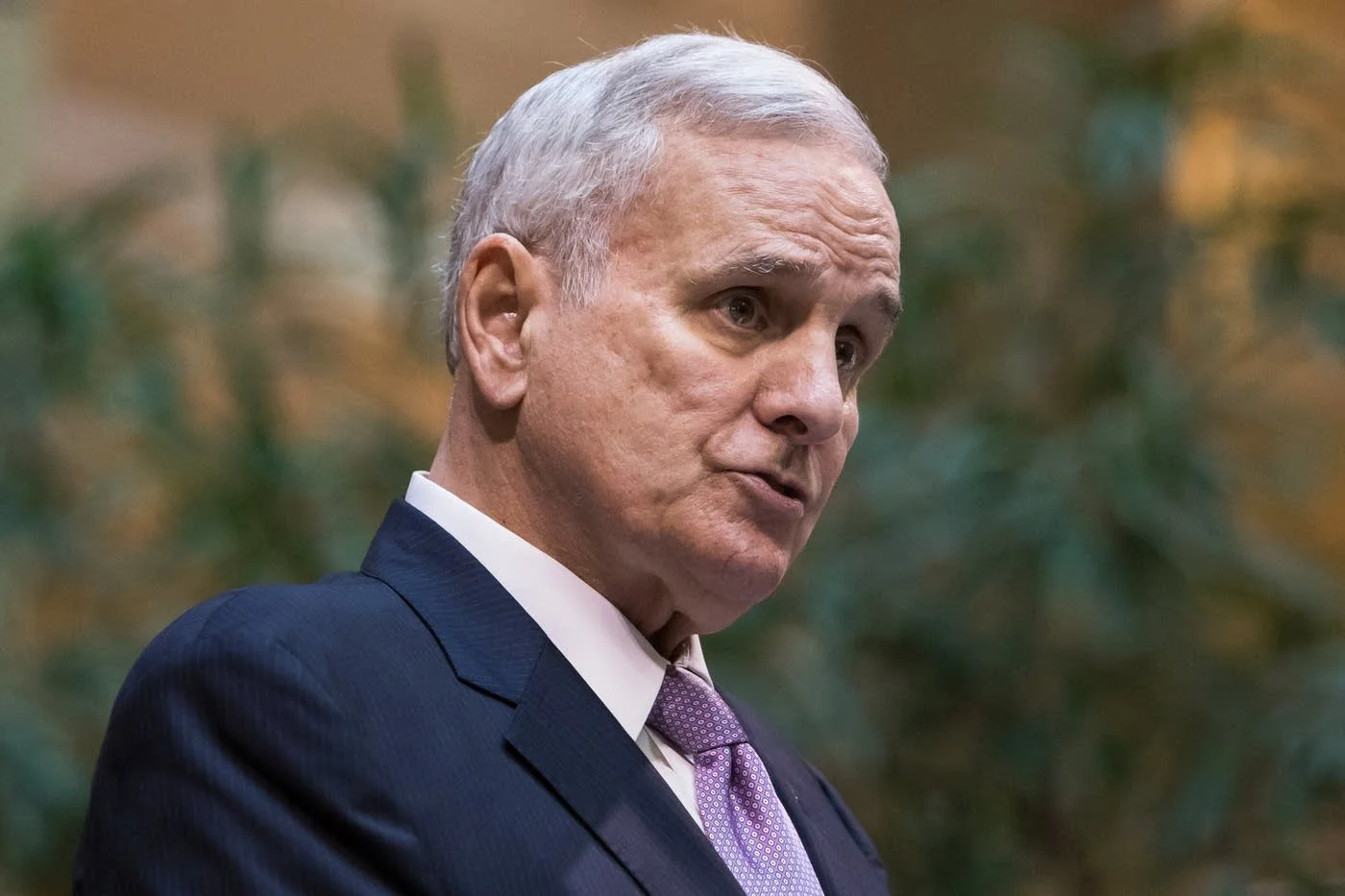Minnesota Governor Mark Dayton speaks to a large crowd during Minnesota Supreme Court justice Paul Thissen's swearing in ceremony at the Landmark Center in St. Paul on July 24, 2018. Dayton is currently serving in his last term as Minnesota's governor. Photo: Lacey Young | MPR News.