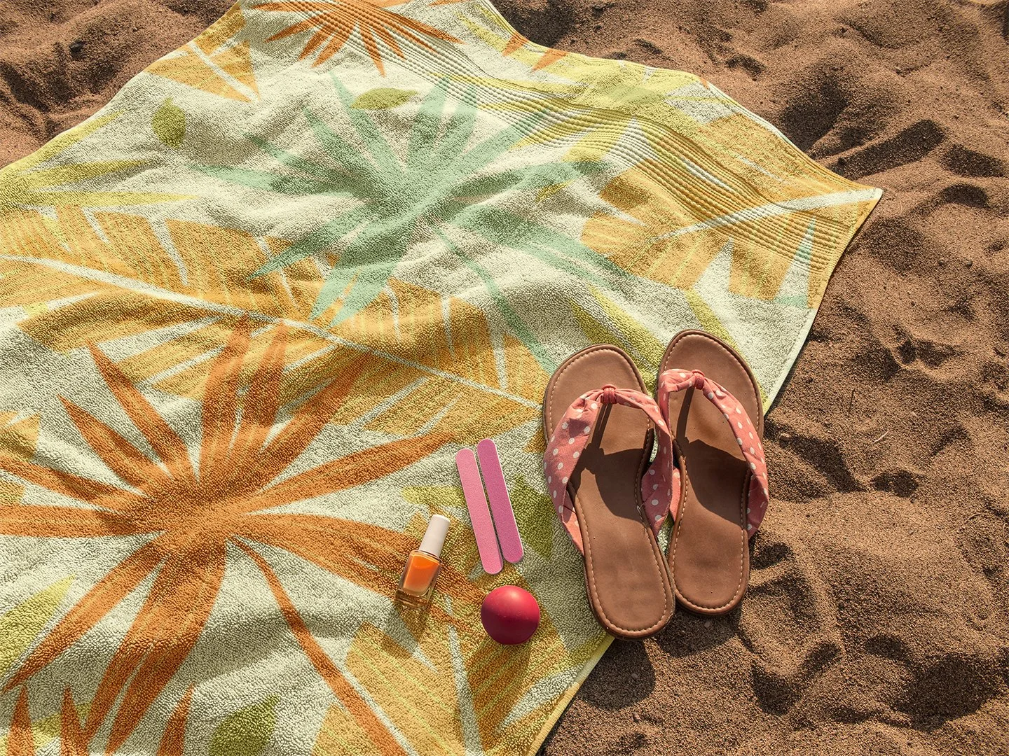 beach-towel-mockup-lying-on-the-sand-with-sandals-and-accessories-on-it-a14890 copy.jpg