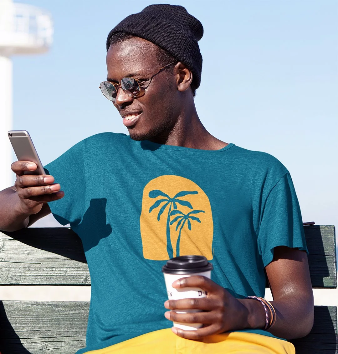 t-shirt-mockup-of-a-man-checking-his-phone-by-the-beach-m2806-r-el2 copy.jpg