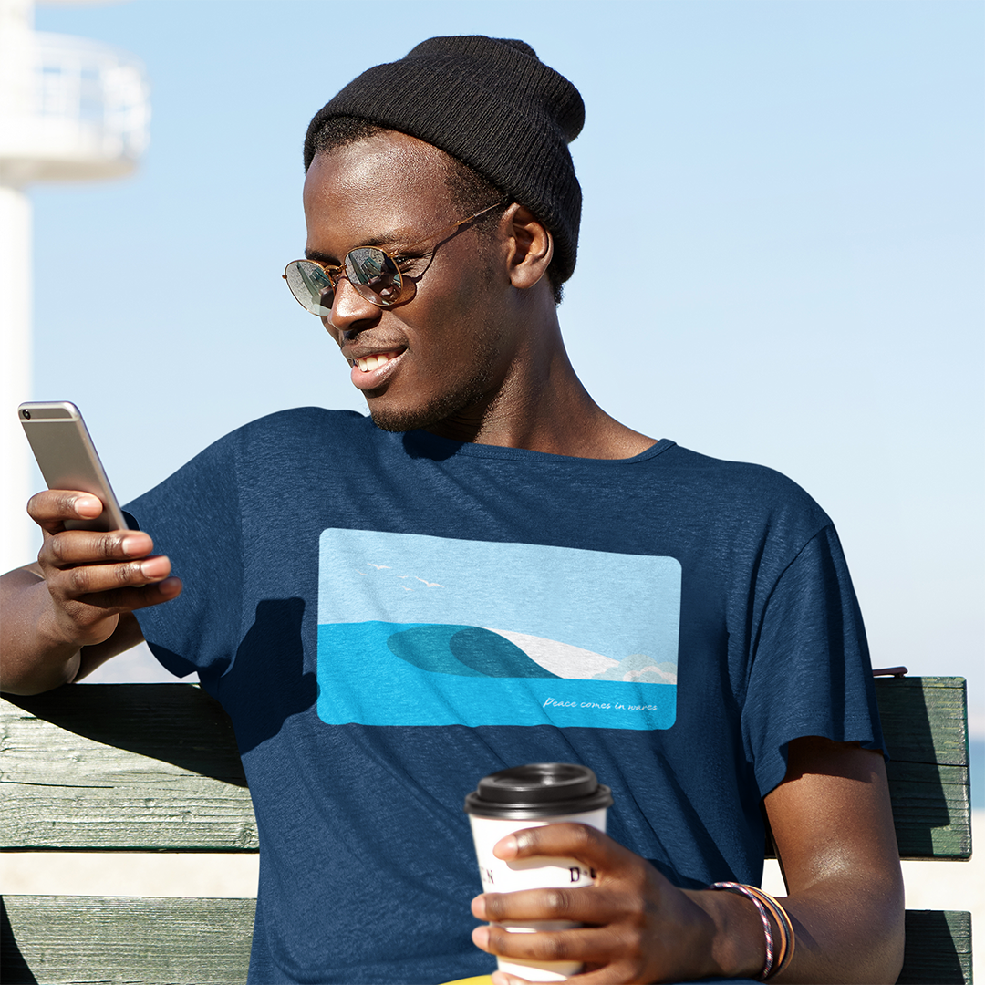 t-shirt-mockup-of-a-man-checking-his-phone-by-the-beach-m2806-r-el2.png