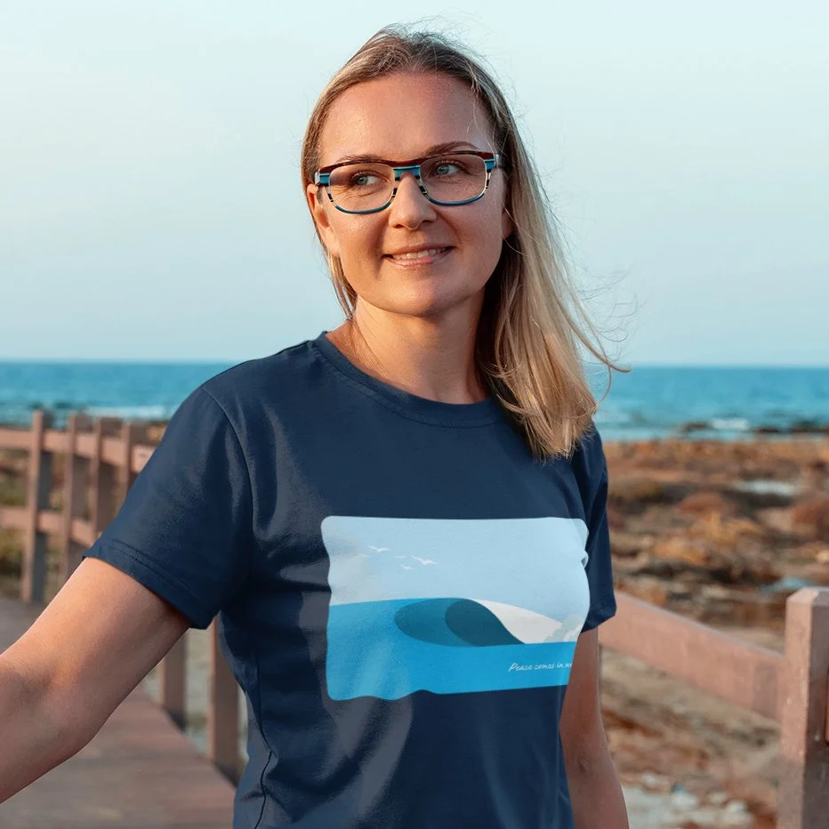 t-shirt-mockup-of-a-woman-with-glasses-standing-on-a-bridge-by-the-beach-m16523-r-el2 (1) copy.jpg