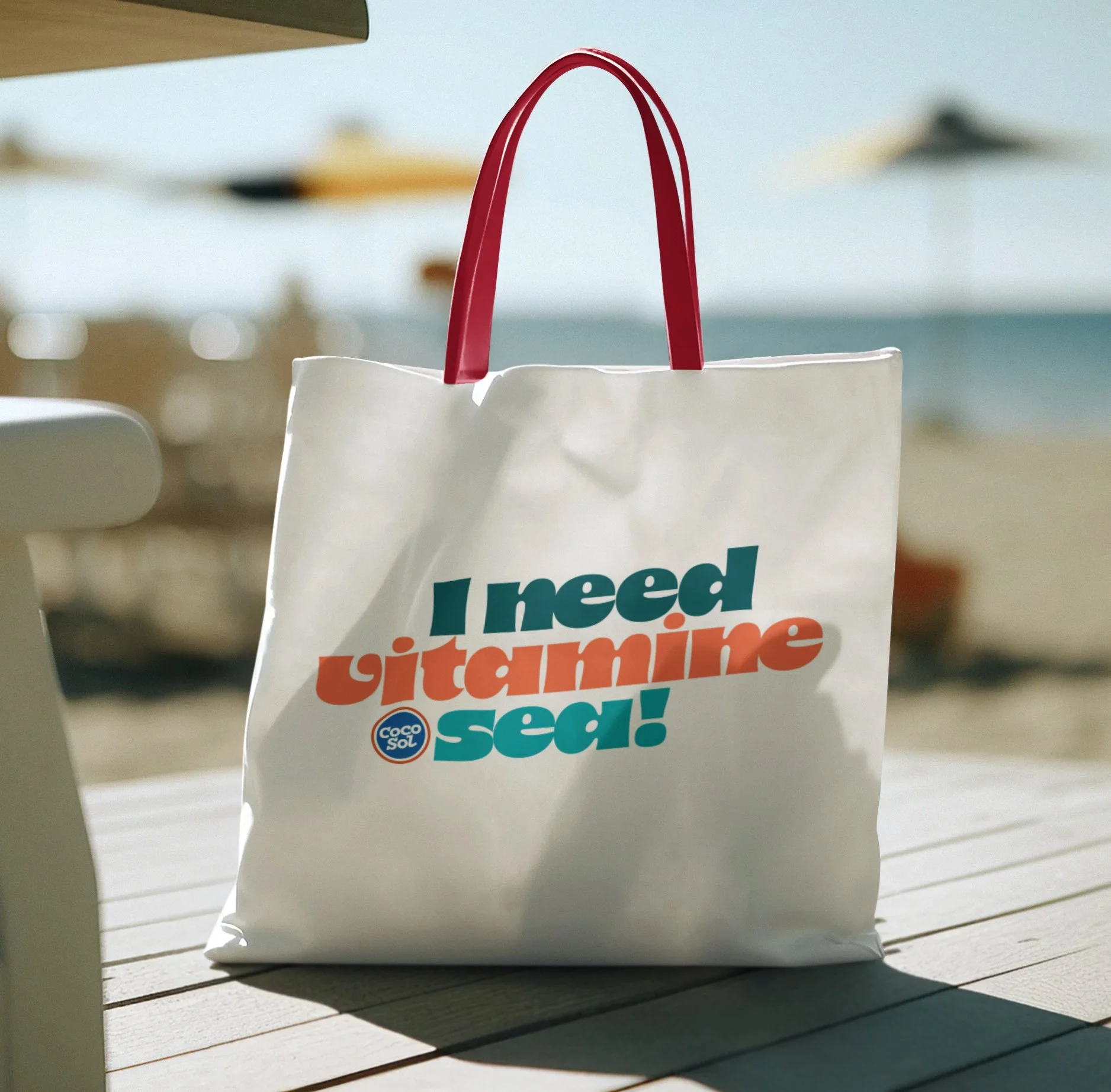 ai-generated-mockup-of-a-tote-bag-placed-on-the-floor-at-the-beach-m33531 copy.jpg