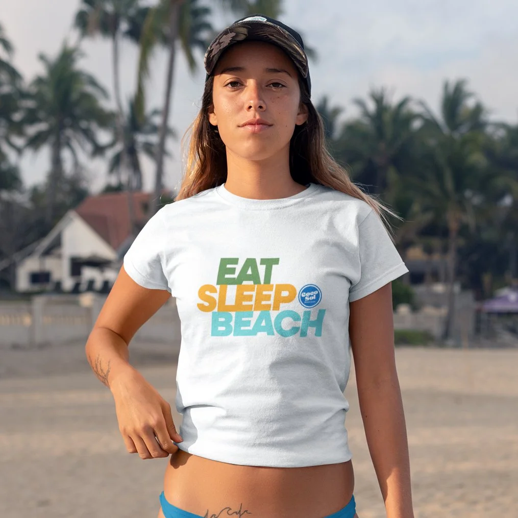 mockup-of-a-young-woman-wearing-a-t-shirt-and-a-bikini-bottom-at-the-beach-26833 copy.jpg