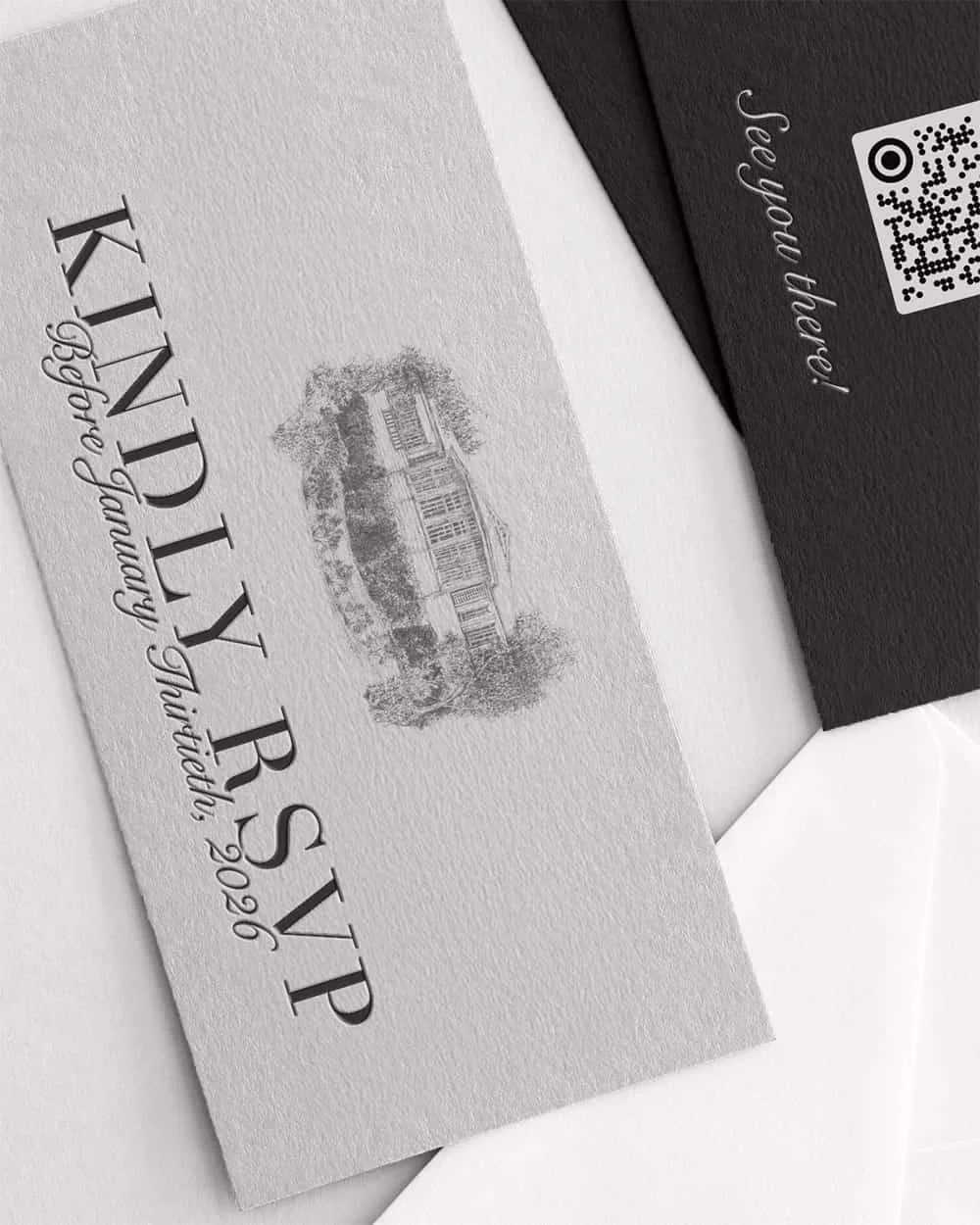 Close-up of a textured white invitation card with a black and white illustration of a house, reading "KINDLY RSVP" and "Please respond by September 29, 2020." partially inside an envelope with a black card that says "See you there!" and includes a QR code.