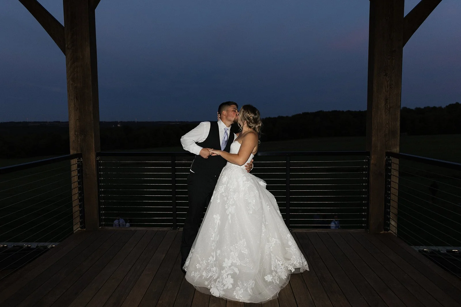 Enjoy a private kiss on the spectactual balcony outdoor space at the best wedding venue Buffalo NY Notting Hill Farm