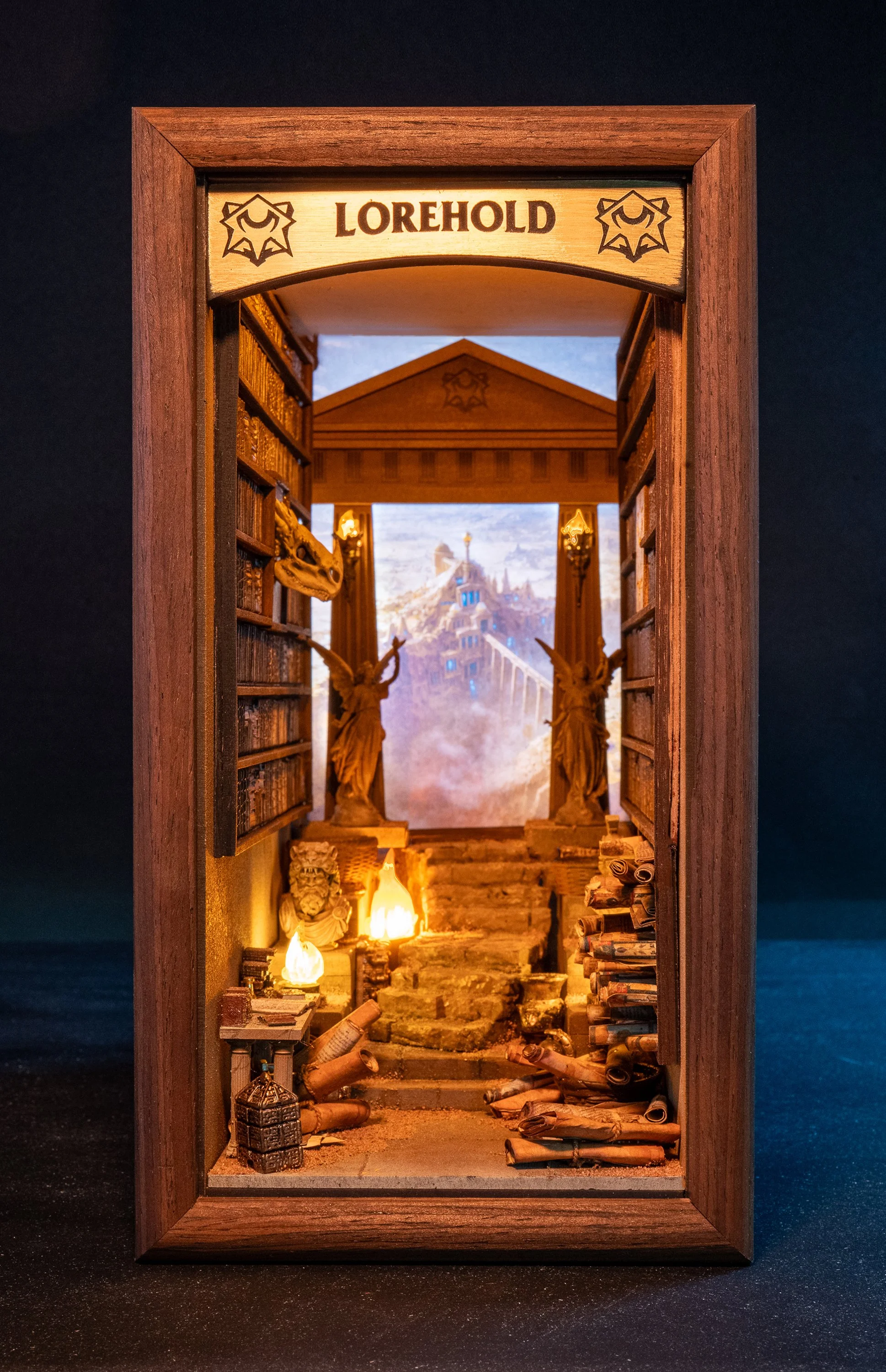 Miniature bookshelf with a sign labeled 'LOREHOLD' at the top, containing tiny books, scrolls, and statuettes of mythical creatures, with a backdrop of a fantasy landscape.