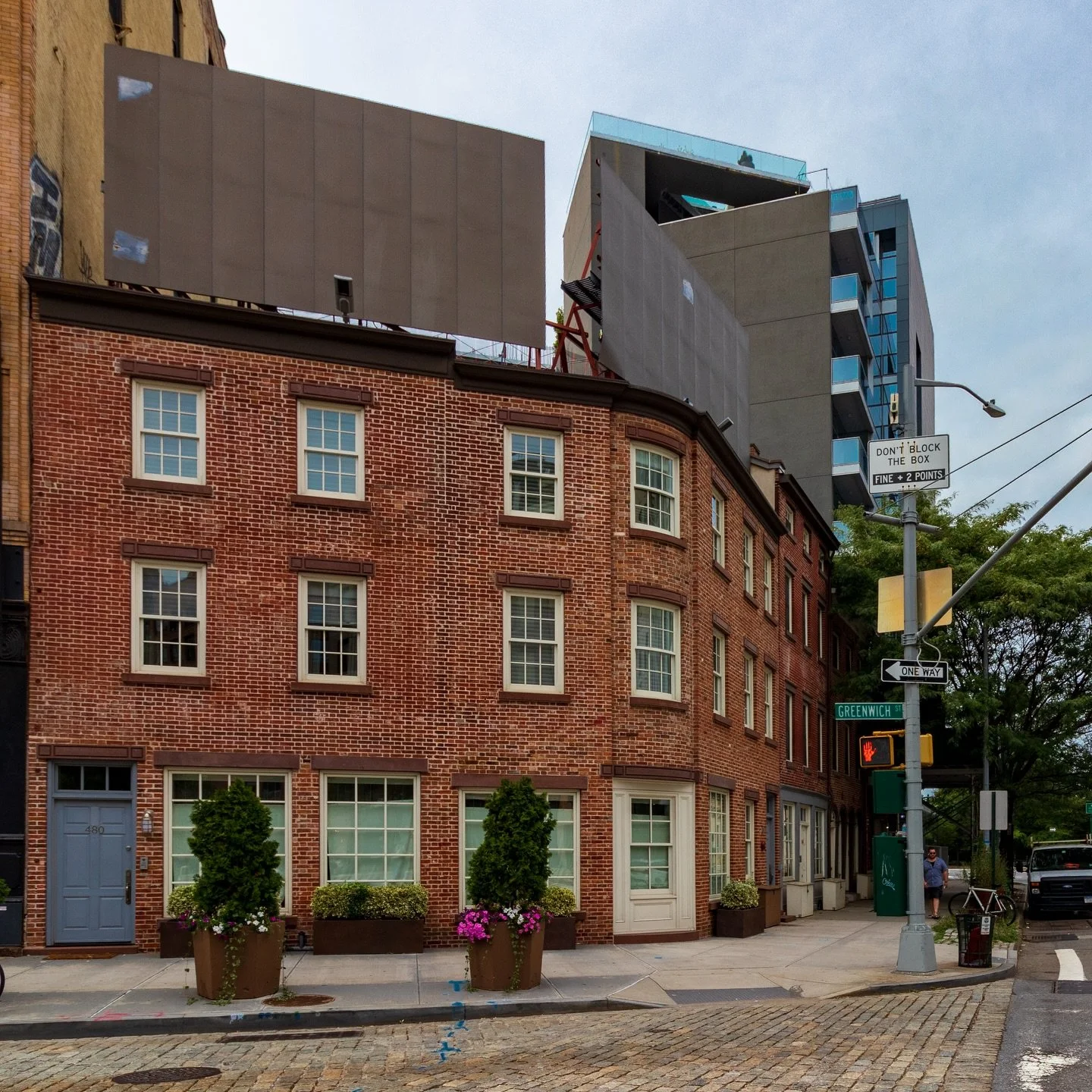 The entrance to the Holland Tunnel is a bleak place. Commuters stuck in traffic slower than walking may have noticed this group of buildings before descending to the depths of the Hudson. They are a rare cluster of early 19th-century shops and houses