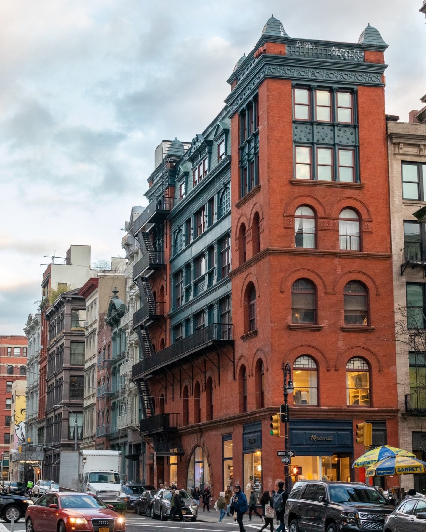 486 Broadway is one of the most visually stunning buildings on Broome Street, with a rather dramatic past. The building that was located here prior to the current one was slated to be demolished; however, the landlord took out a $35k insurance policy