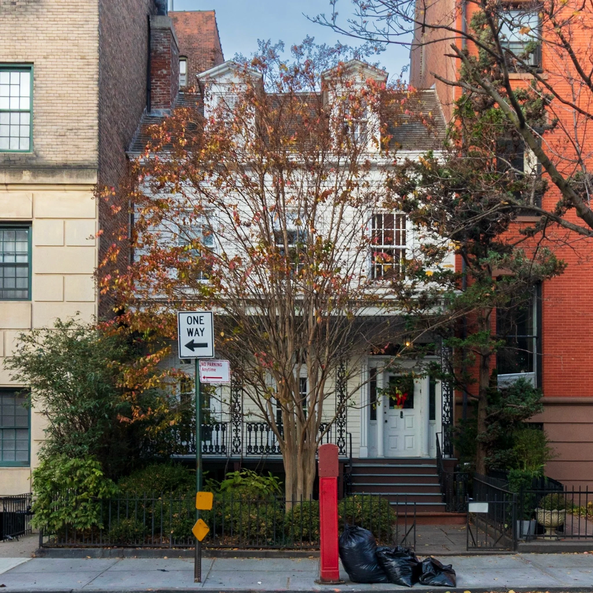 This quaint little house sandwiched between two much newer buildings is 135 Joralemon Street in Brooklyn Heights. It is one of the oldest houses in the neighborhood but is located much further away from most of the remaining clapboard houses in the d