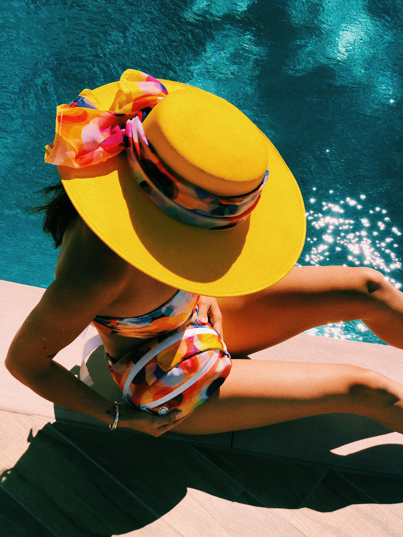 woman in bright yellow reflecting sun hat in palm springs.JPG