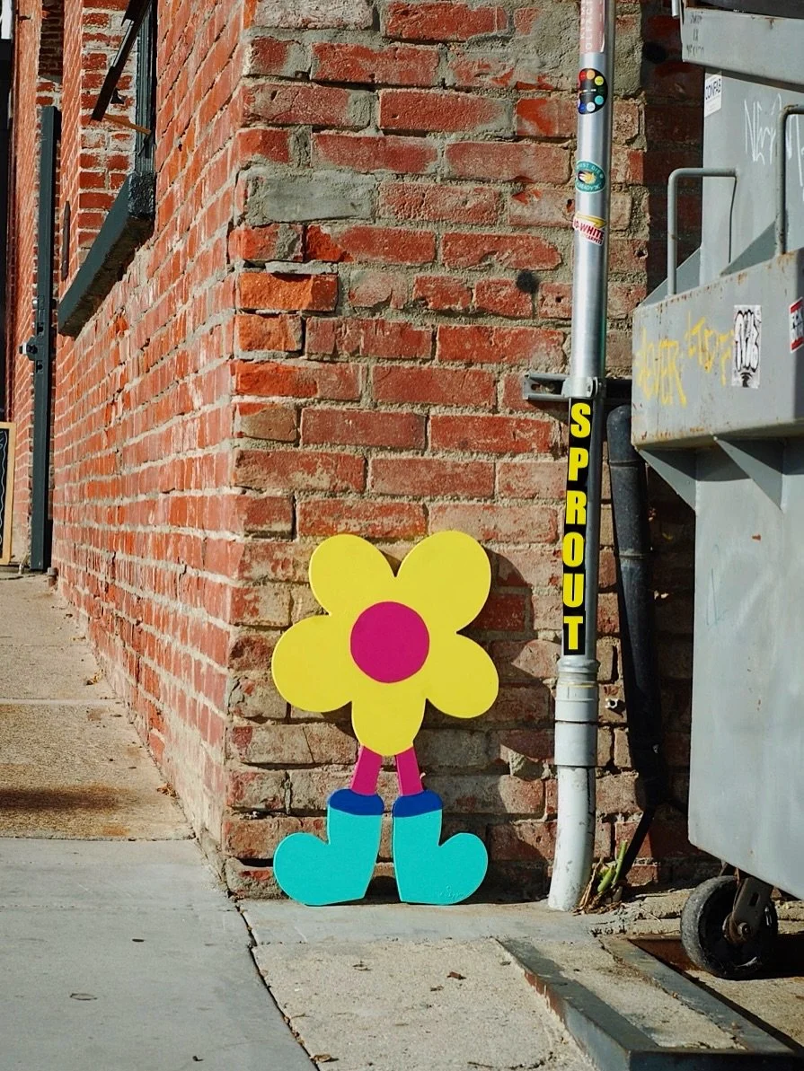 Meet SPROUT 🌱 Character #1 in the BLOOMERS series. Standing 24 inches tall and 15 inches wide, each hand-painted wooden BLOOMER is a flower-powered character made to brighten any space, indoors or out.
Lean it casually, hang it proudly, or let it s