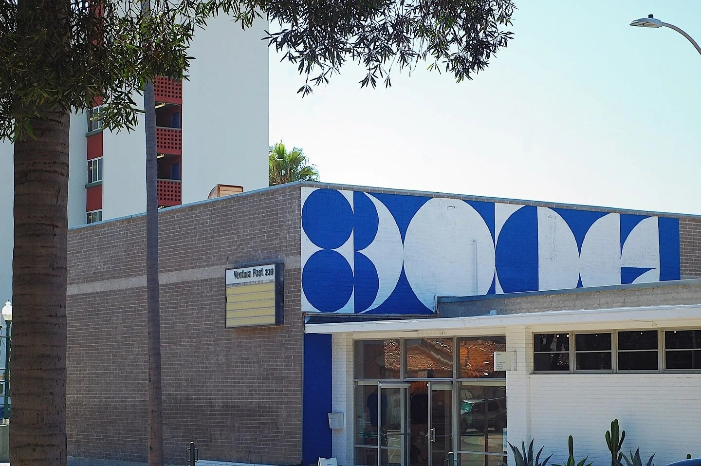 New 11 x 44 foot rooftop mural 🌀🌊 Phase I in @superbloom.world Loyal Blue 💙 “a simple, bold, abstract design celebrating coastal creative culture influenced by midcentury modern design. The circles play off the sun, the moon, the tides - nau