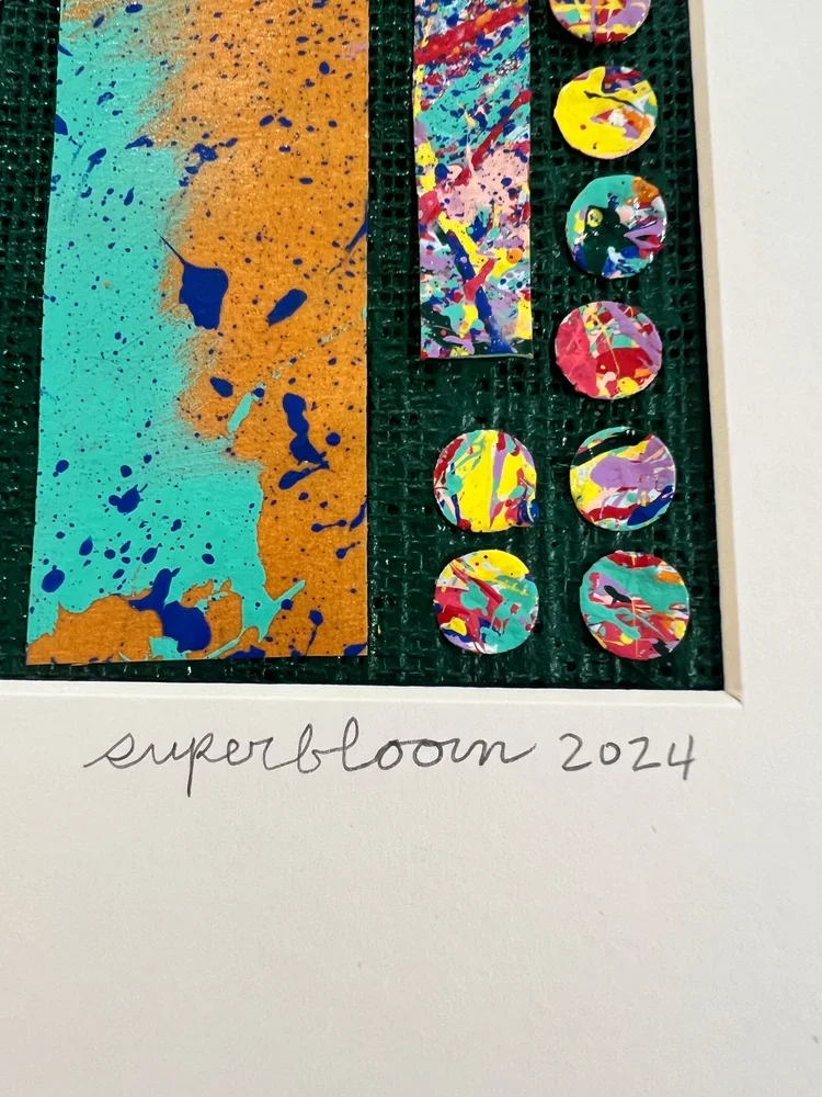 signature close-up of SUPERBLOOM 2024 on framed Repurpose No. 2 artwork showing circular paint fragments and textured green linen