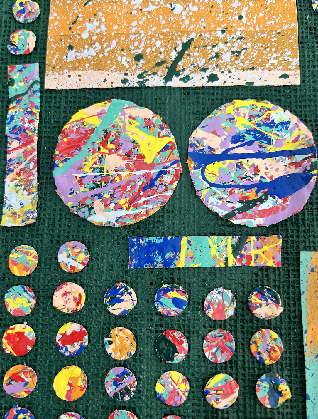 Close-up detail of SUPERBLOOM’s Repurpose No. 2, showing large circular paint-splatter cutouts and textured upcycled linen in Offline Green