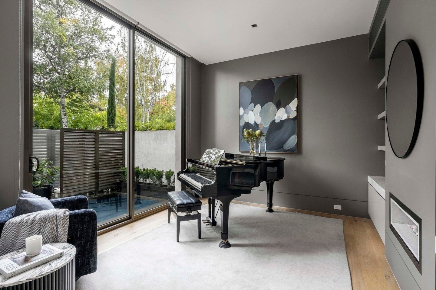 Charcoal grey walls are the perfect tone for this music room.⁠
Moody and contemplative. Styling was kept minimal and focused.⁠
⁠
Styling | @cooperrobinsoninteriors⁠
Stylist | @neilmitchell⁠
______________⁠
⁠
1B Cleeve Court ⁠
Toorak⁠
______________⁠

