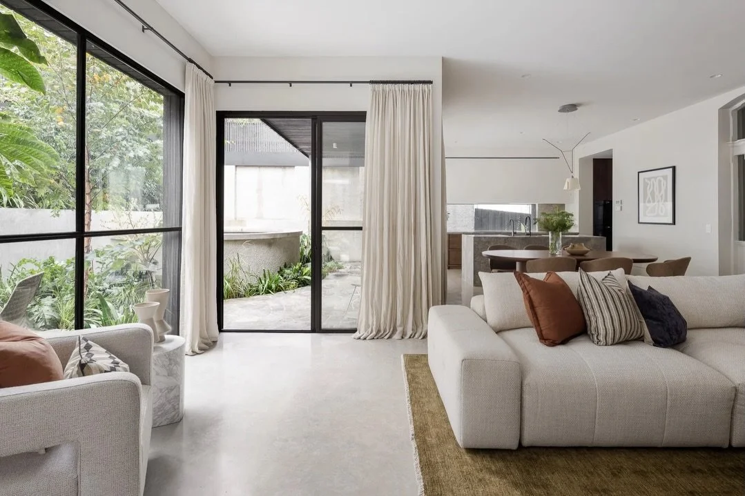 We did warn you! Spamming this one!

With such strong architectural elements (polished concrete, black framing, stone island bench) we opted for muted colour palette and subtle curves that mirror the elegant staircase. And we think it looks pretty da