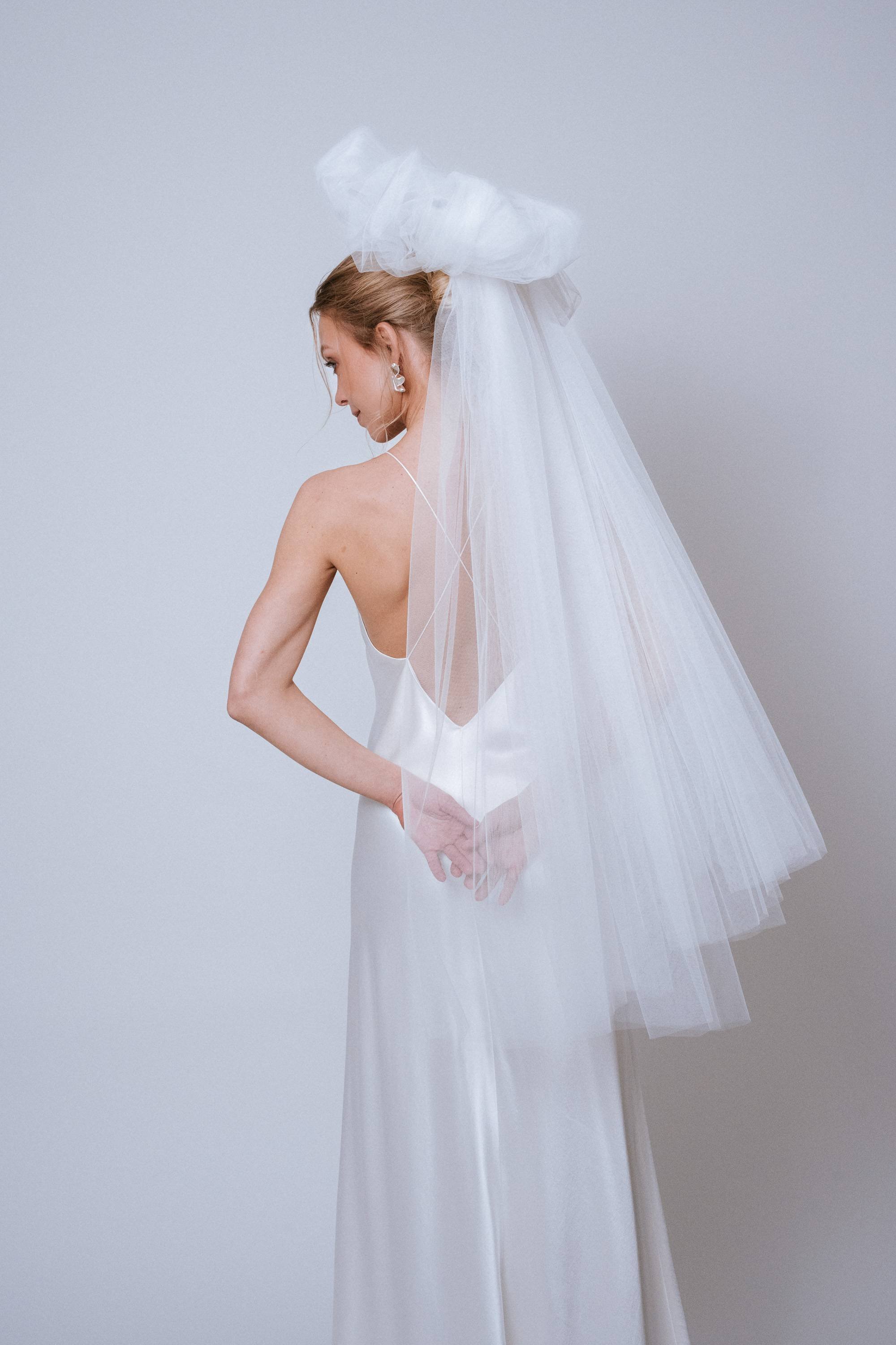 Side view of the Statement Bow Veil revealing sculptural shape and tie length