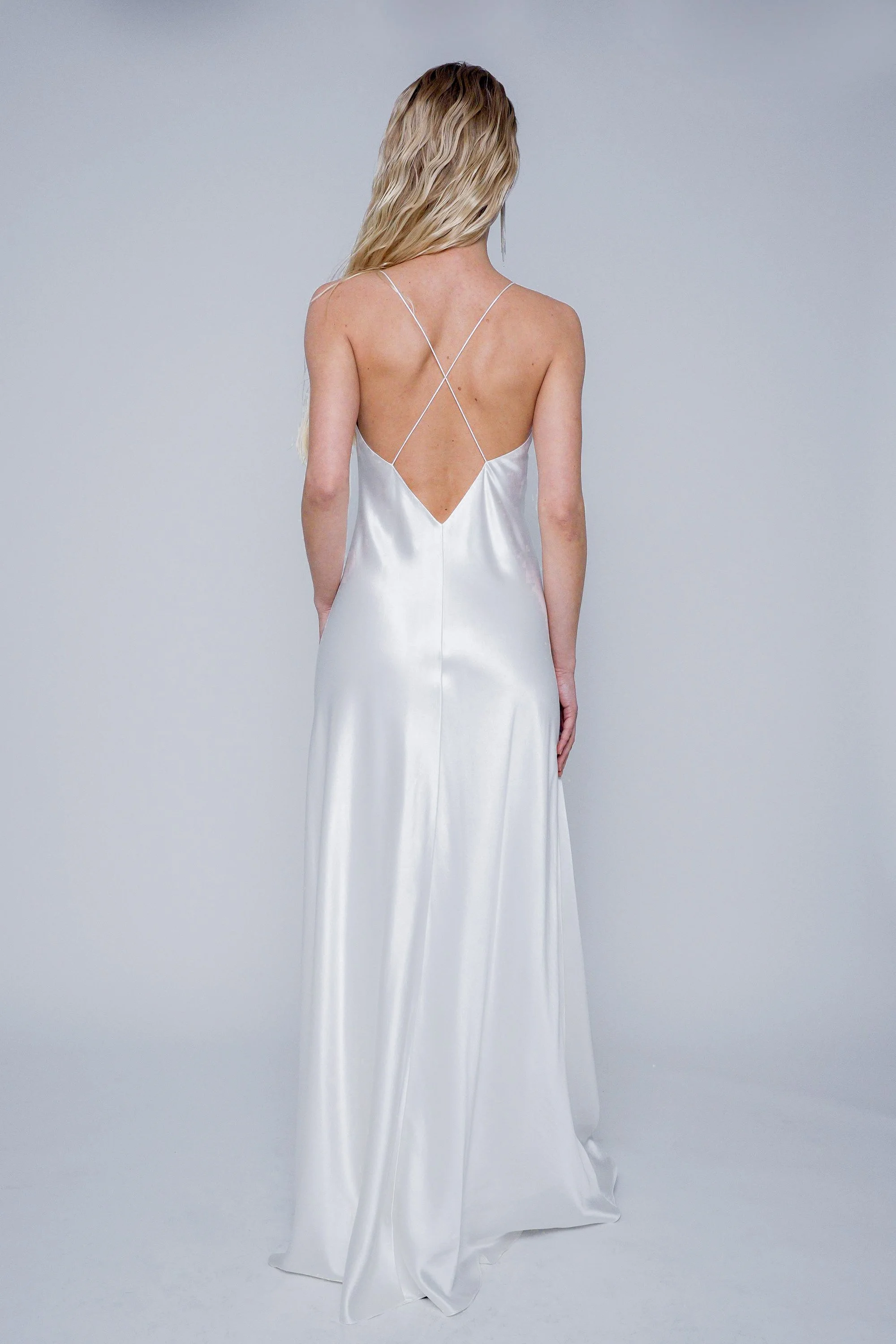 Back view of Yaiza Gown Silk on model size 36 featuring low back and crossed spaghetti straps