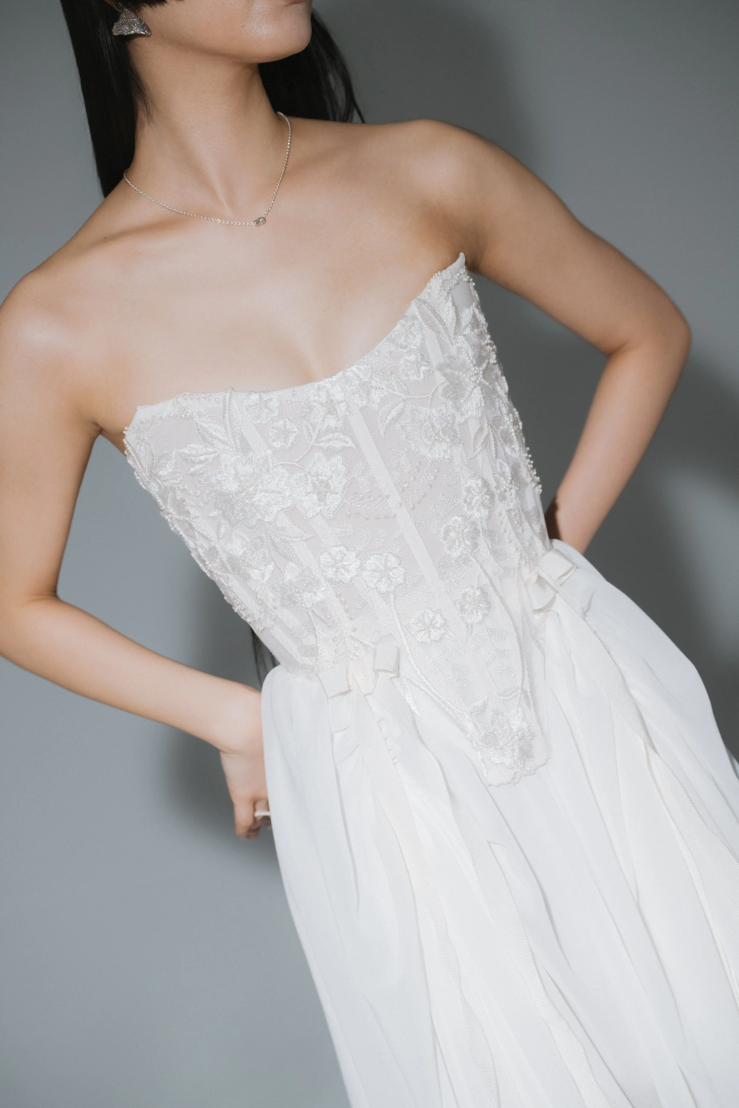 Ivory bridal lace corset top with Victorian-inspired silhouette and visible boning