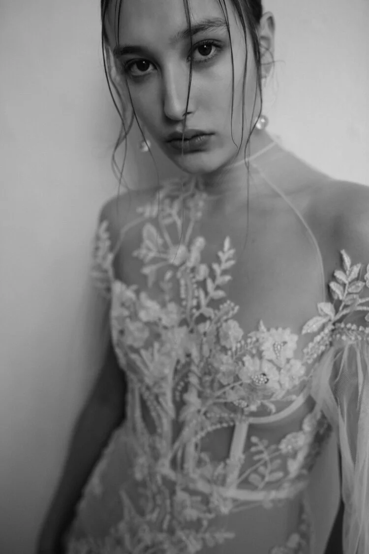 Ivory sheer lace bridal couture dress with a modern, transparent silhouette