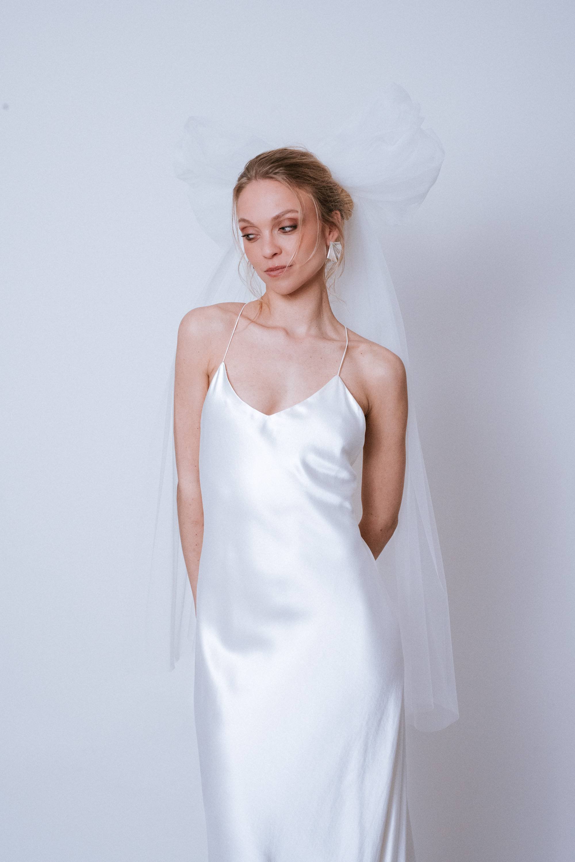 Close-up front view of the Statement Bow showing tulle texture and bow form at crown