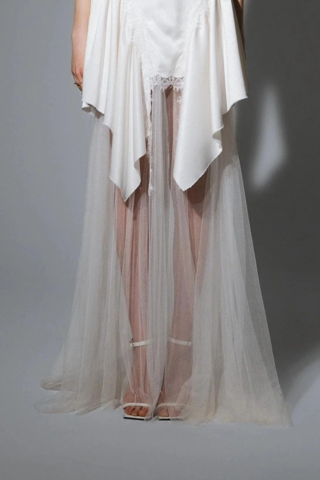 Floor-length ivory bridal tulle skirt with front slit and flowing full-circle silhouette