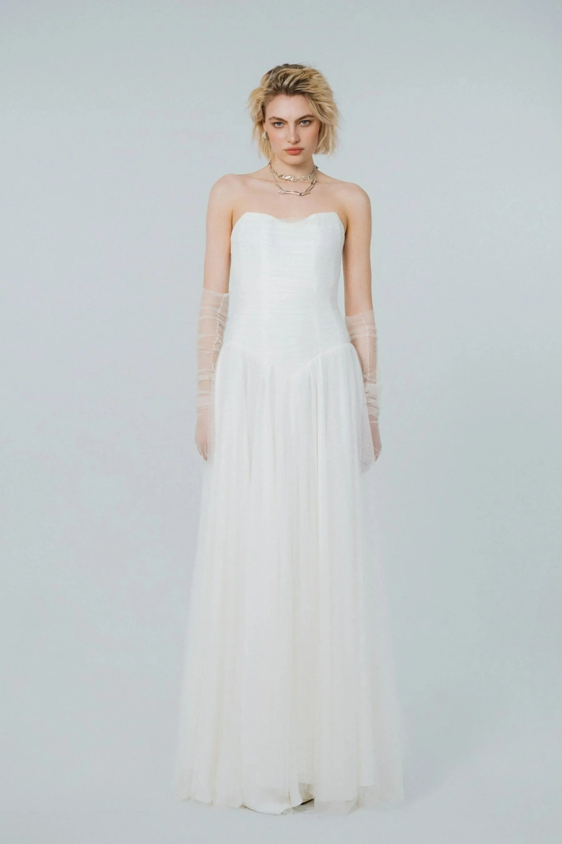 Ivory soft tulle bridal gown with corset bodice, sweetheart neckline and flowing A-line skirt by Ritual Unions Berlin