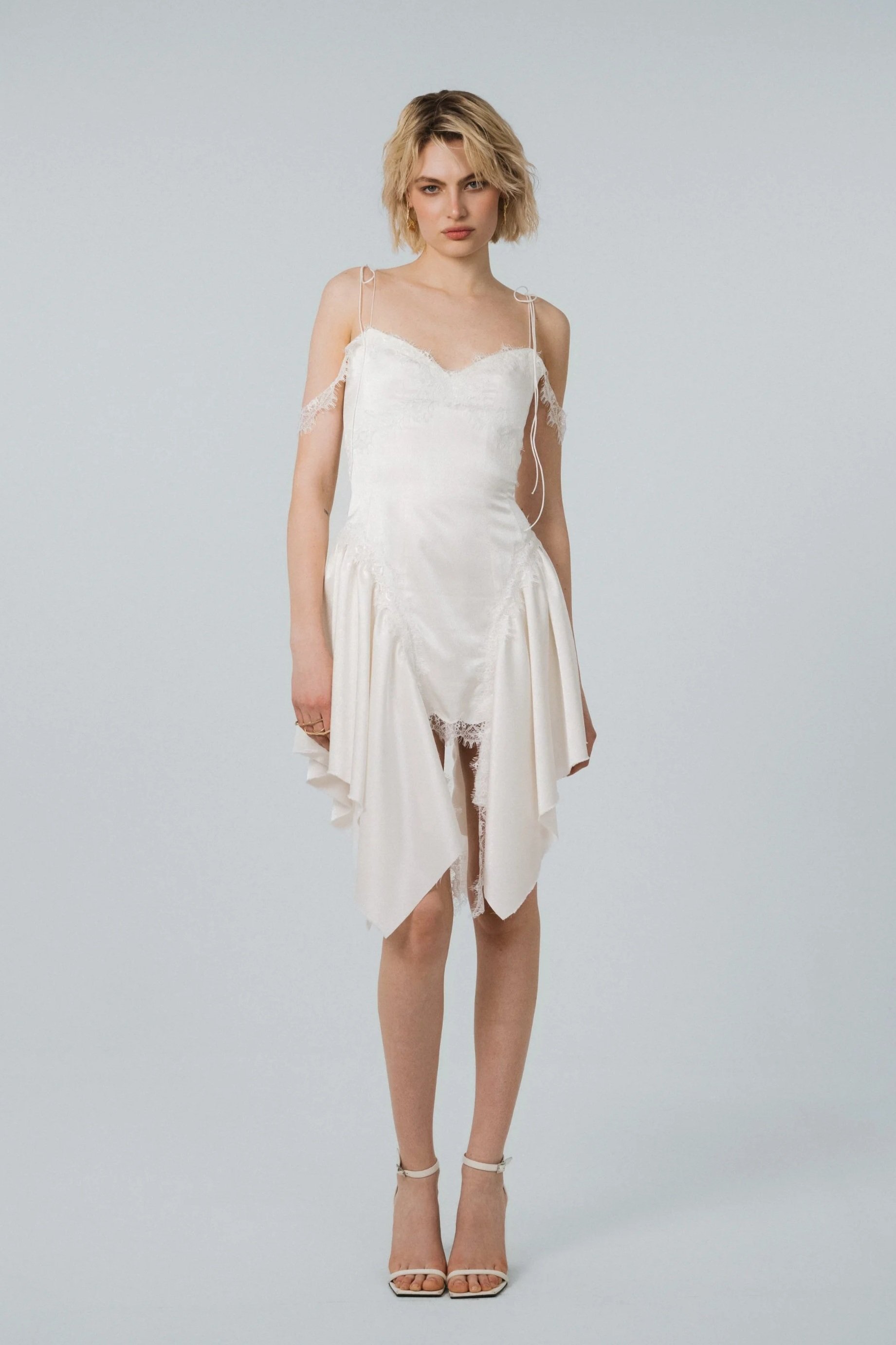 Ivory bridal mini dress with bows on shoulders, lace details and voluminous Victorian-inspired skirt
