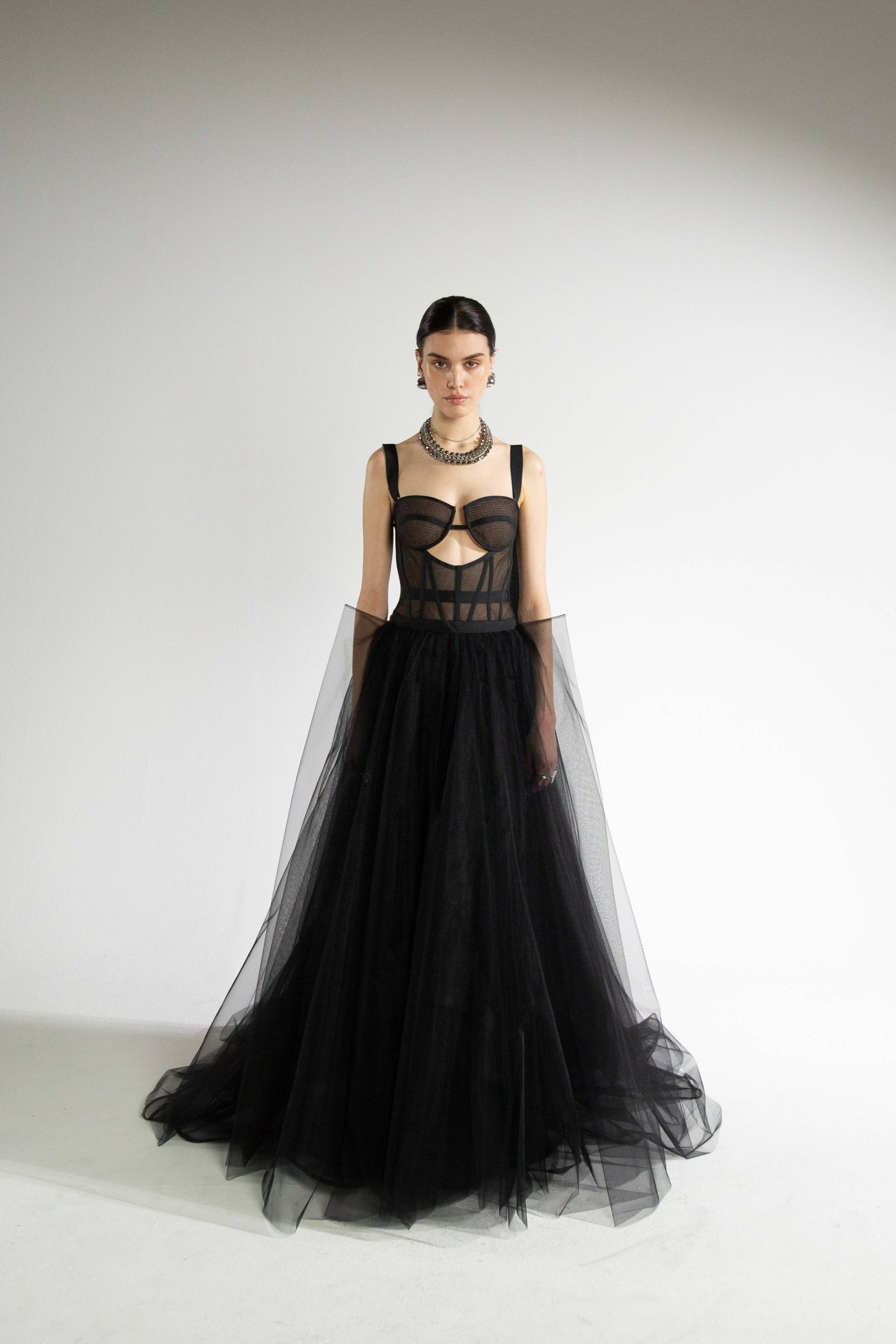 Front view of the Untamed Gown in black showing tulle ballgown silhouette and cut-out bodice