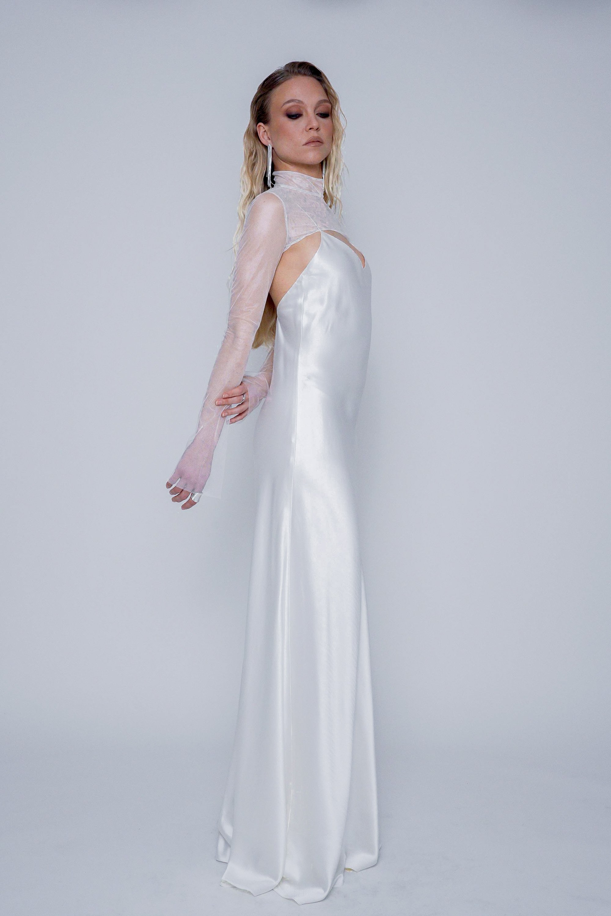 Side view of the Nada Top showing sleeve length and cropped silhouette