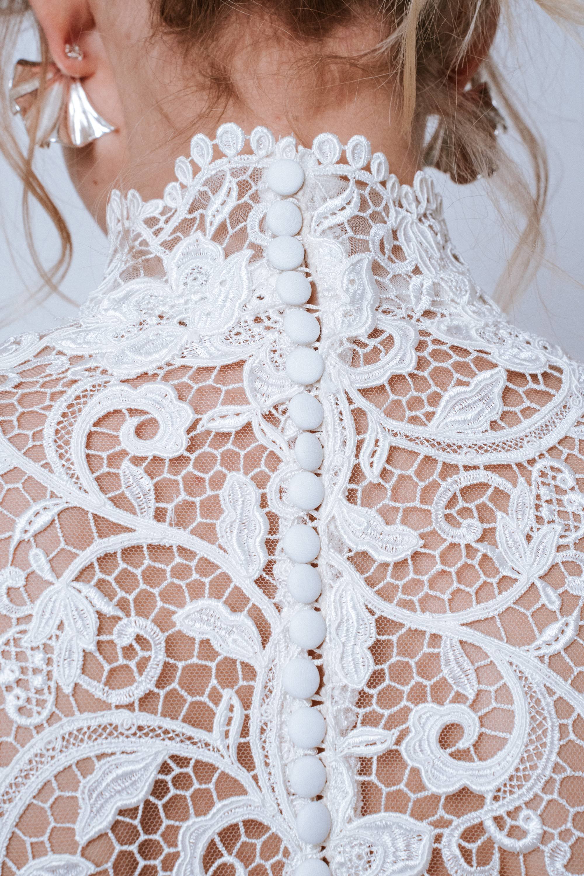 Detail shot of neck closure buttons on the back of Valé Dress