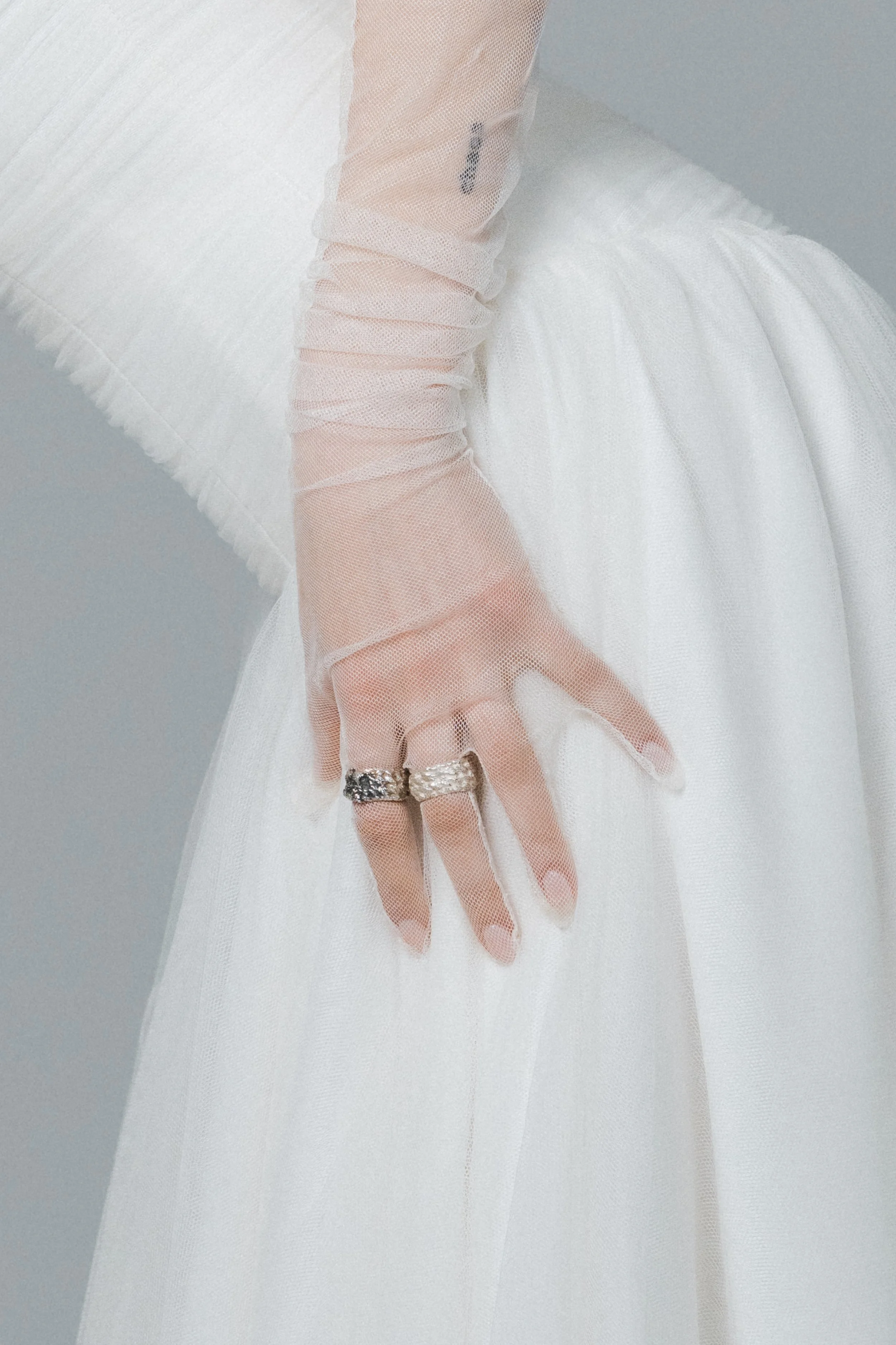 Close-up of gathered soft tulle texture and delicate transparency of the Nada Gloves