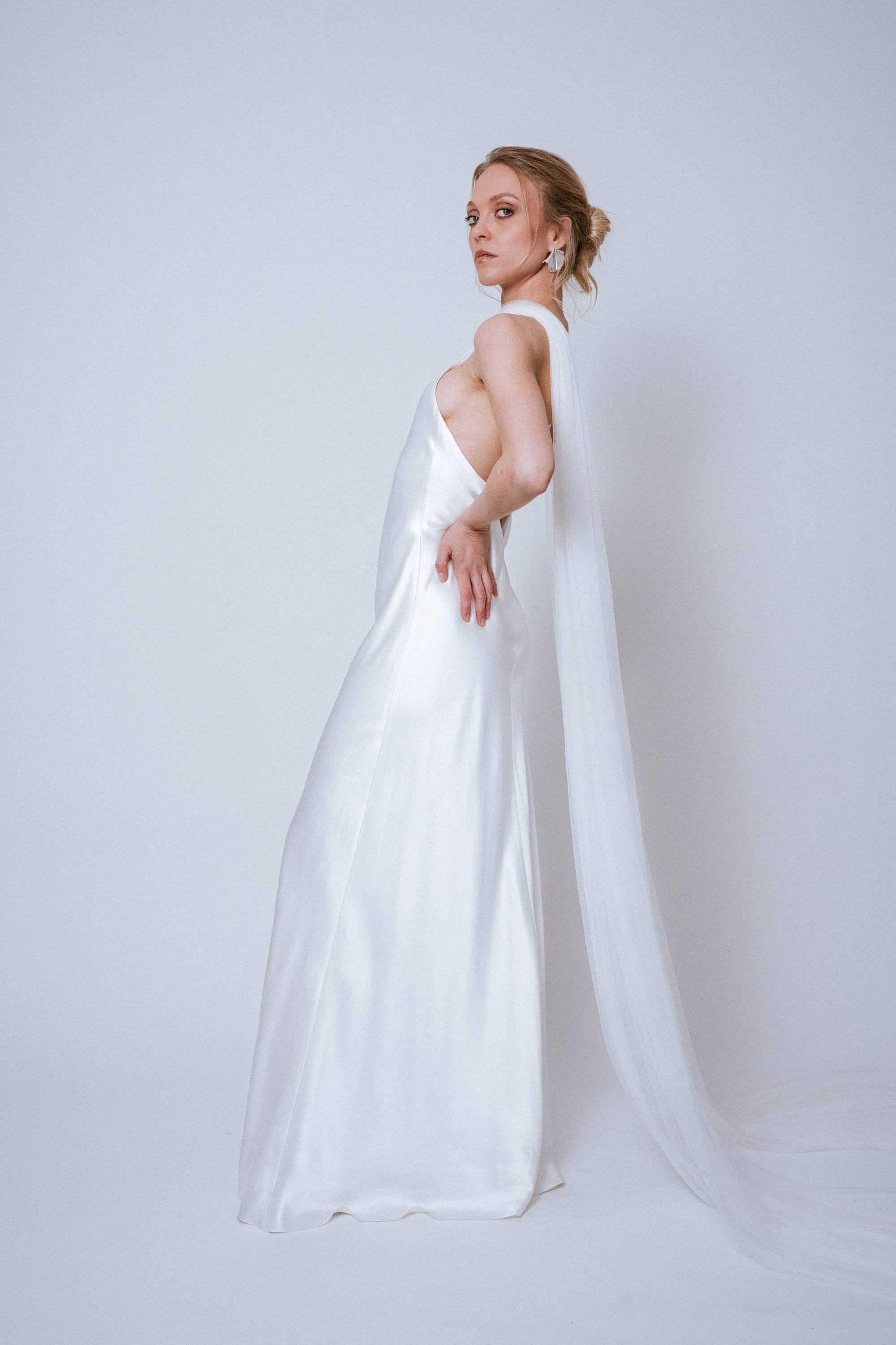 Side view of the Softtulle Scarf showing soft tulle drape and trailing ends extending to the floor