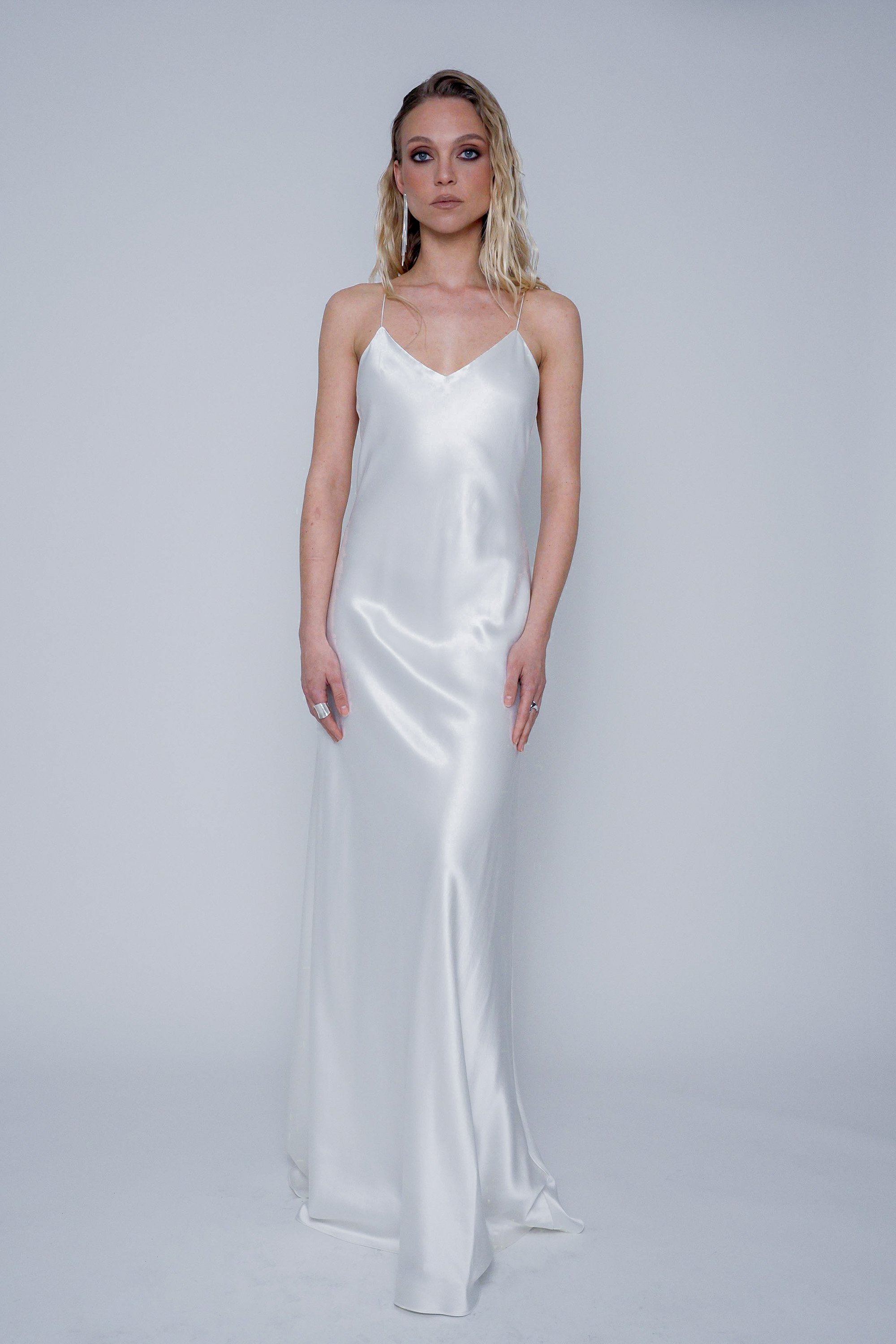 Front view of the Yaiza Gown Silk showing bias-cut silhouette, deep neckline, and elegant drape