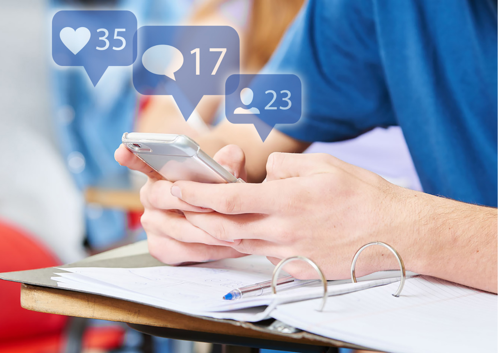 Male student on social media on his phone with blue engagement bubbles