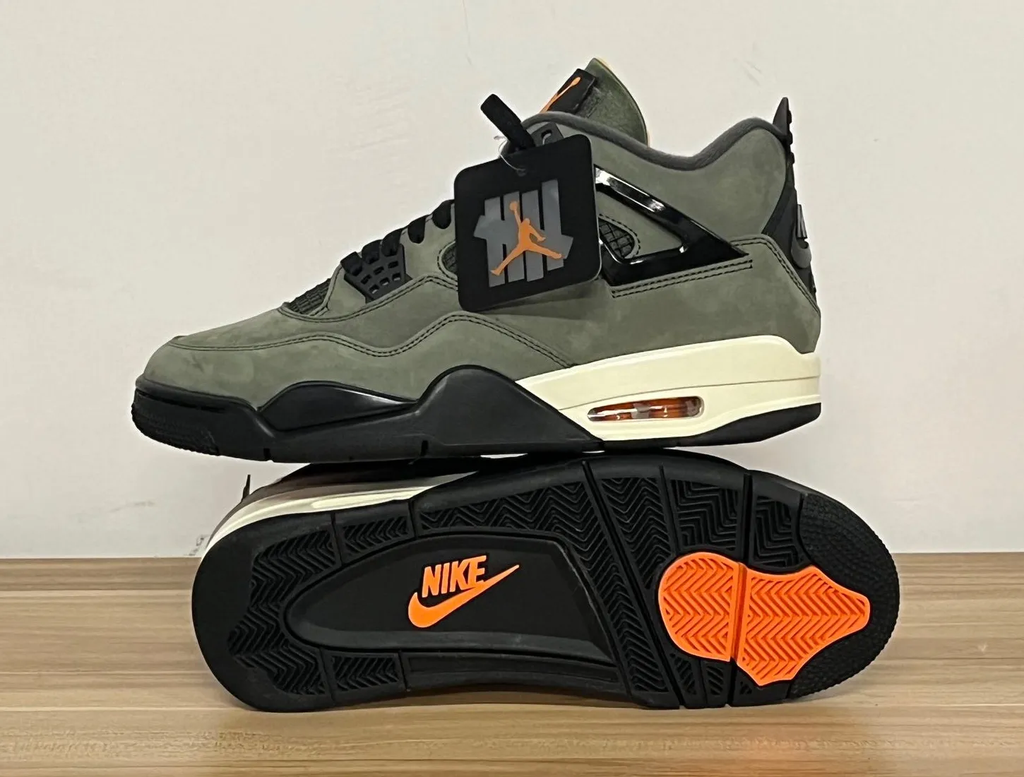 Undefeated-Air-Jordan-4-Outsole-Nike-Logo.png