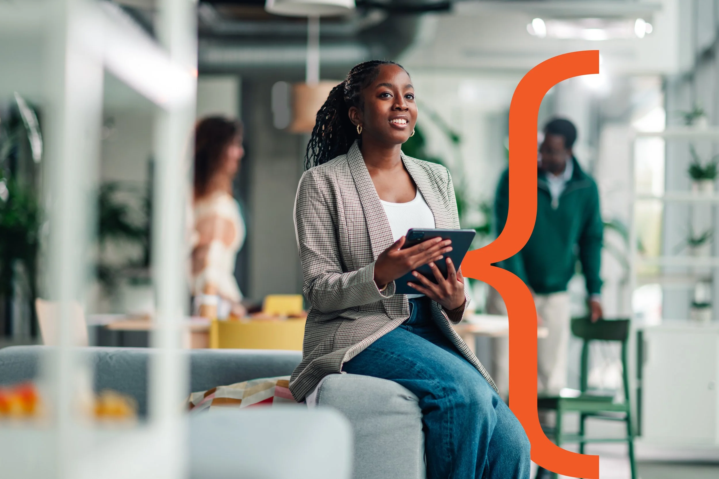 Woman sitting in office with RUACH branding