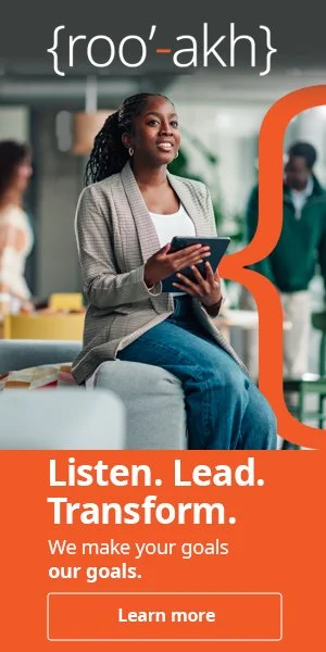 A woman sitting in an office environment, holding a tablet, with text overlay providing pronunciation and a slogan 'Listen. Lead. Transform.' about goal achievement and leadership.