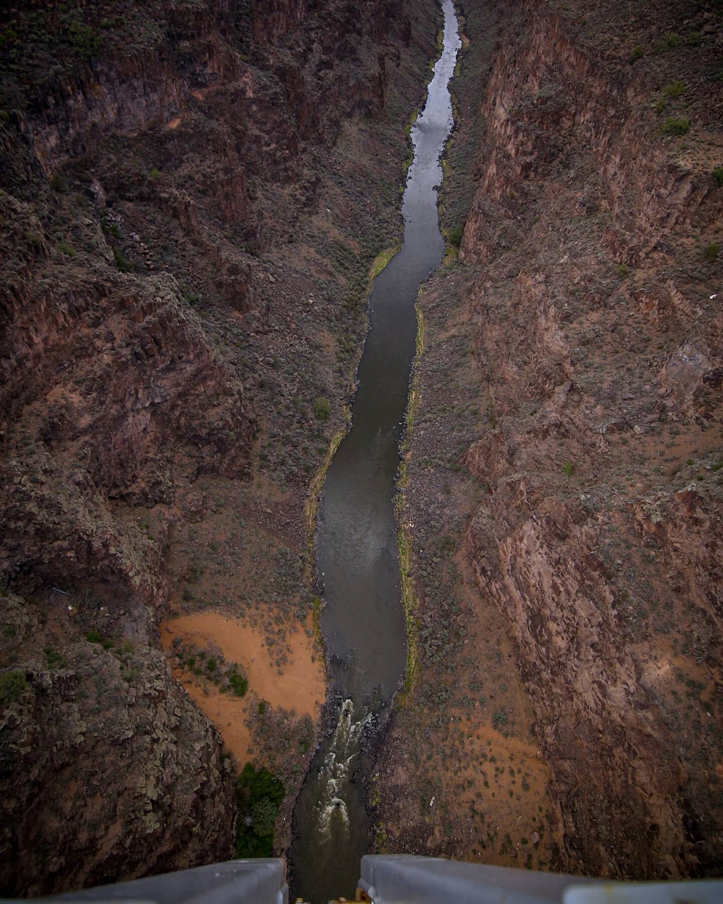In Taos, we visited the Rio Grande Gorge Bridge, where you can look 656 feet down at the Rio Grande River. It is every bit vertigo inducing as it Umi's gorgeous. Here, shot on a wide angle lens, you can see the bridge on which we stood, down to the r