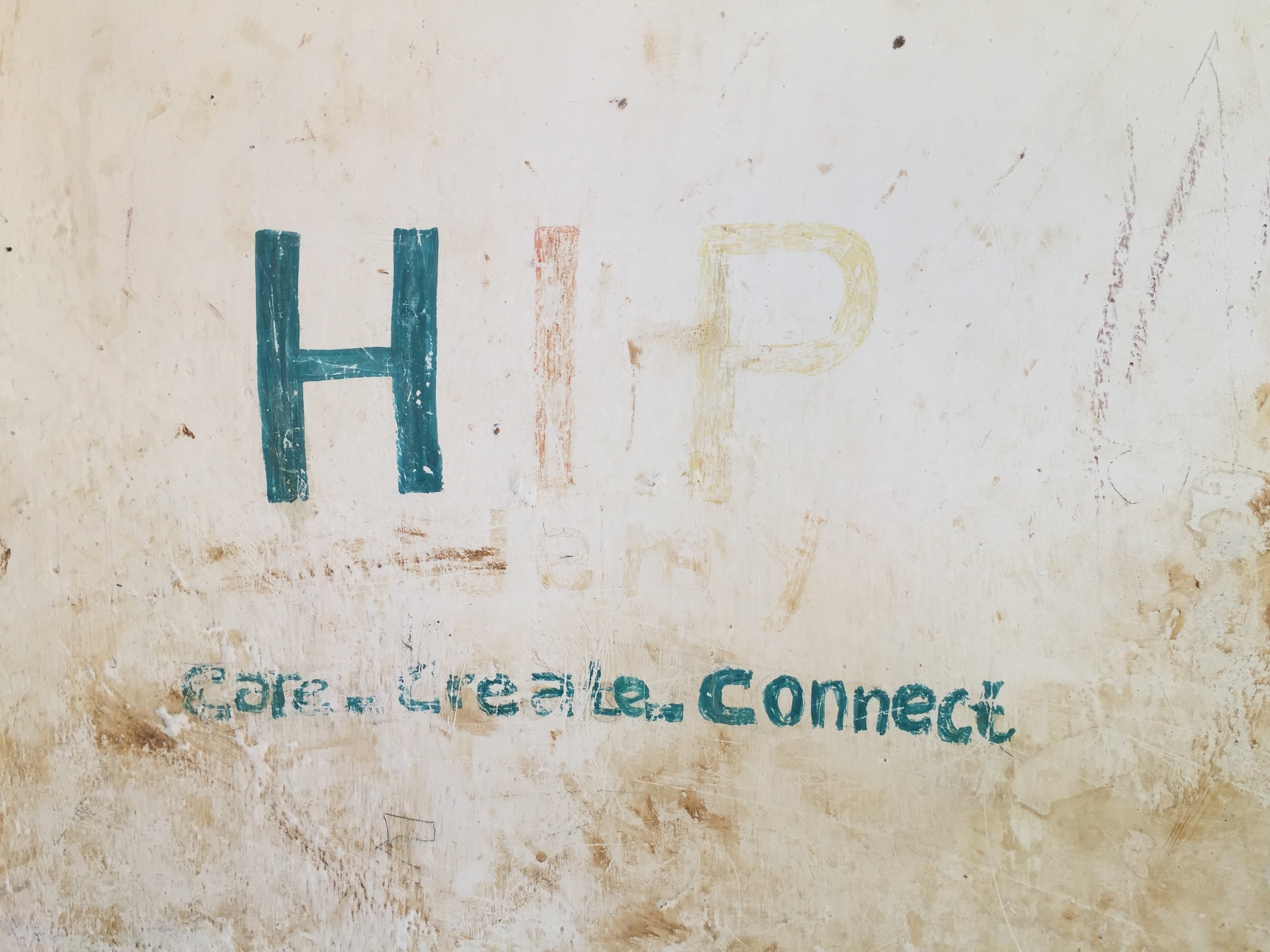  On one of the outside walls of the school was this painted sign with "HIP" written on it as well as a school motto: "Care. Create. Connect". Both were starting to fade from time and weather. 