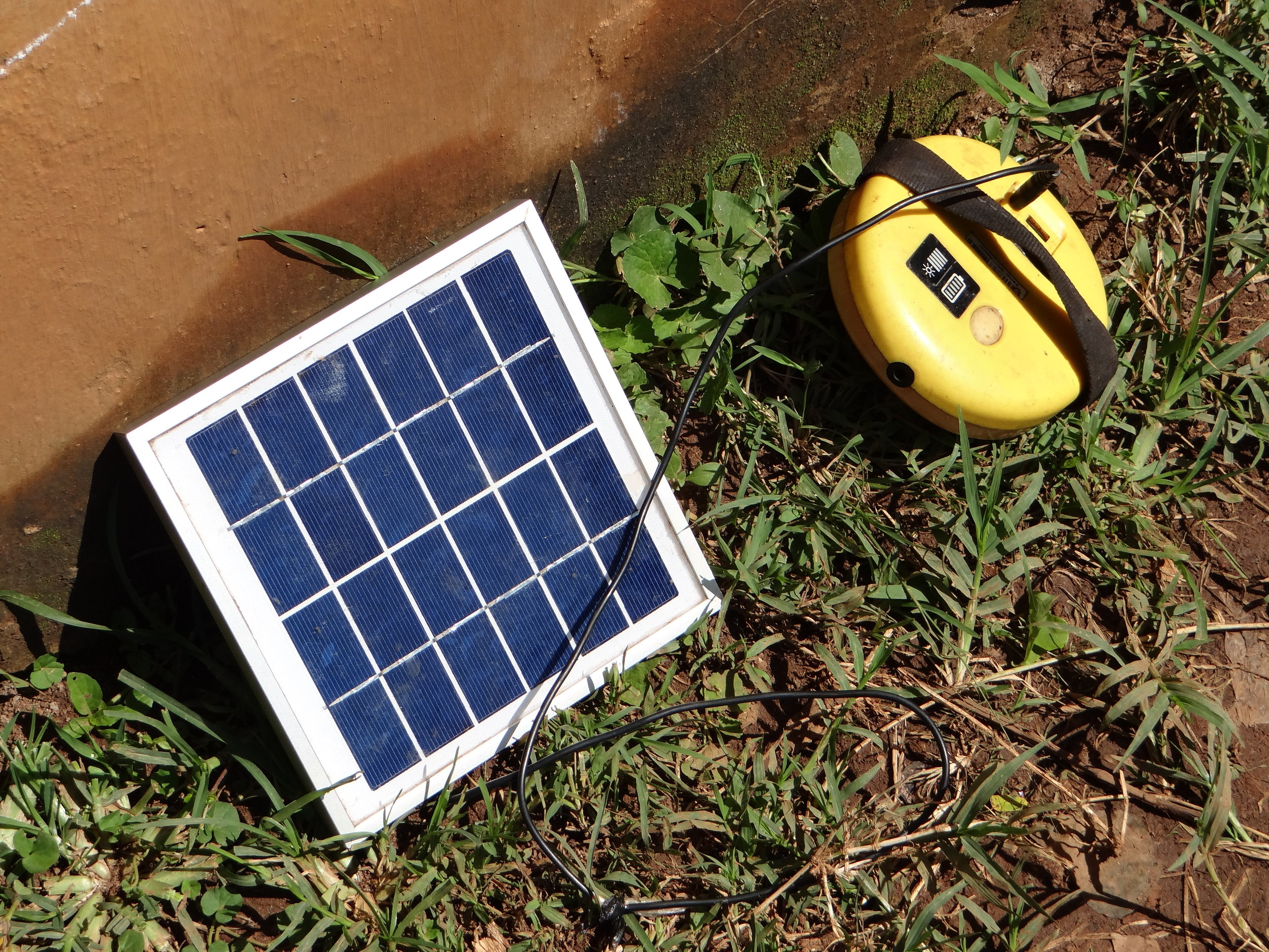 Because of the sometimes inconsistent electricity, this is a solar panel that HIP uses to charge their electronic devices--things like phones, laptops, and iPads. The technology plugs into it, while it would rest on the metal roof of the school.