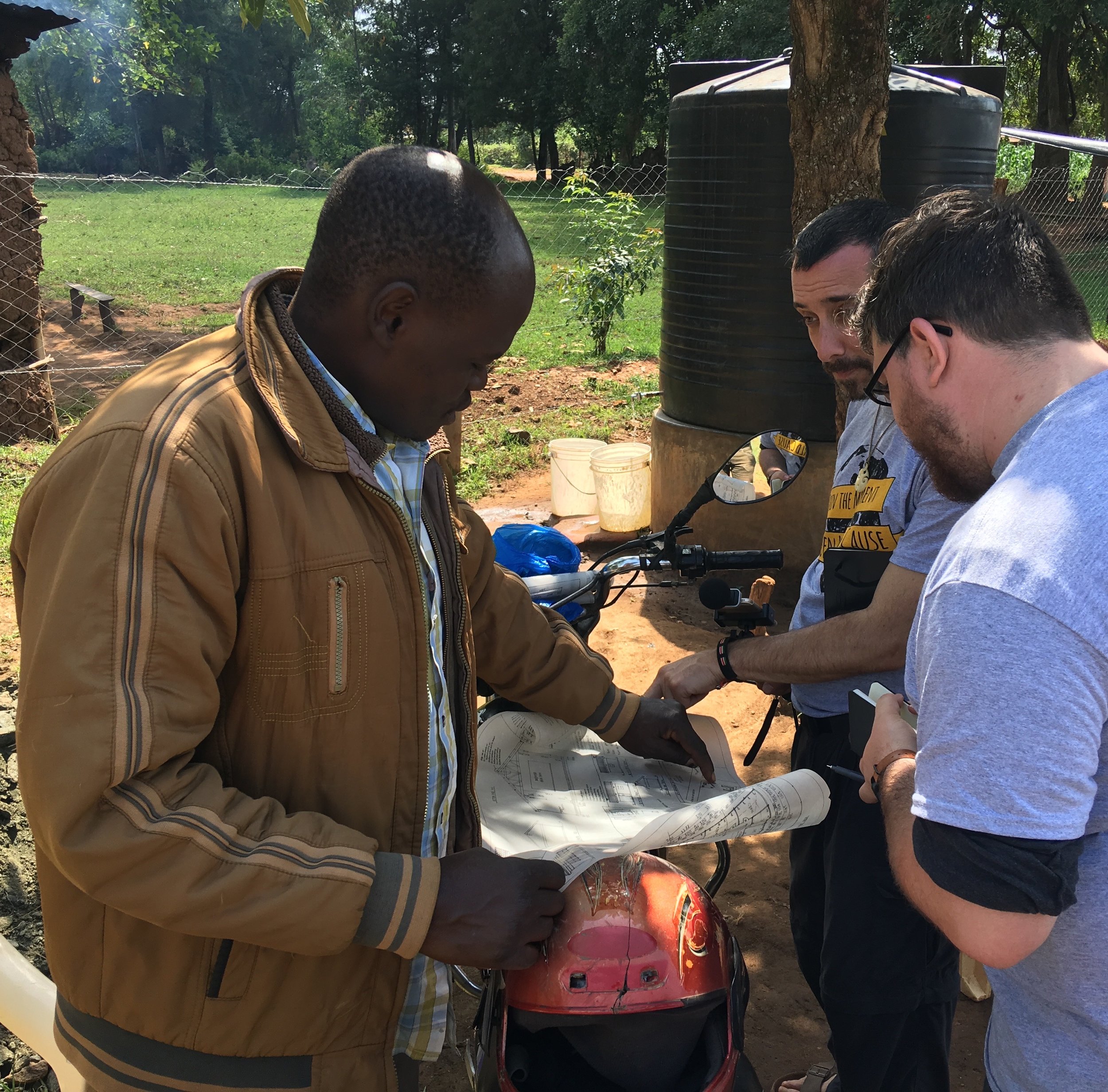 Here, John and Connor, an American Architect, meets with Albert, a local architect. Together, they talked about the structural integrity of the buildings and brainstormed ideas for ways to fortify the current latrine while also making plans for a ne