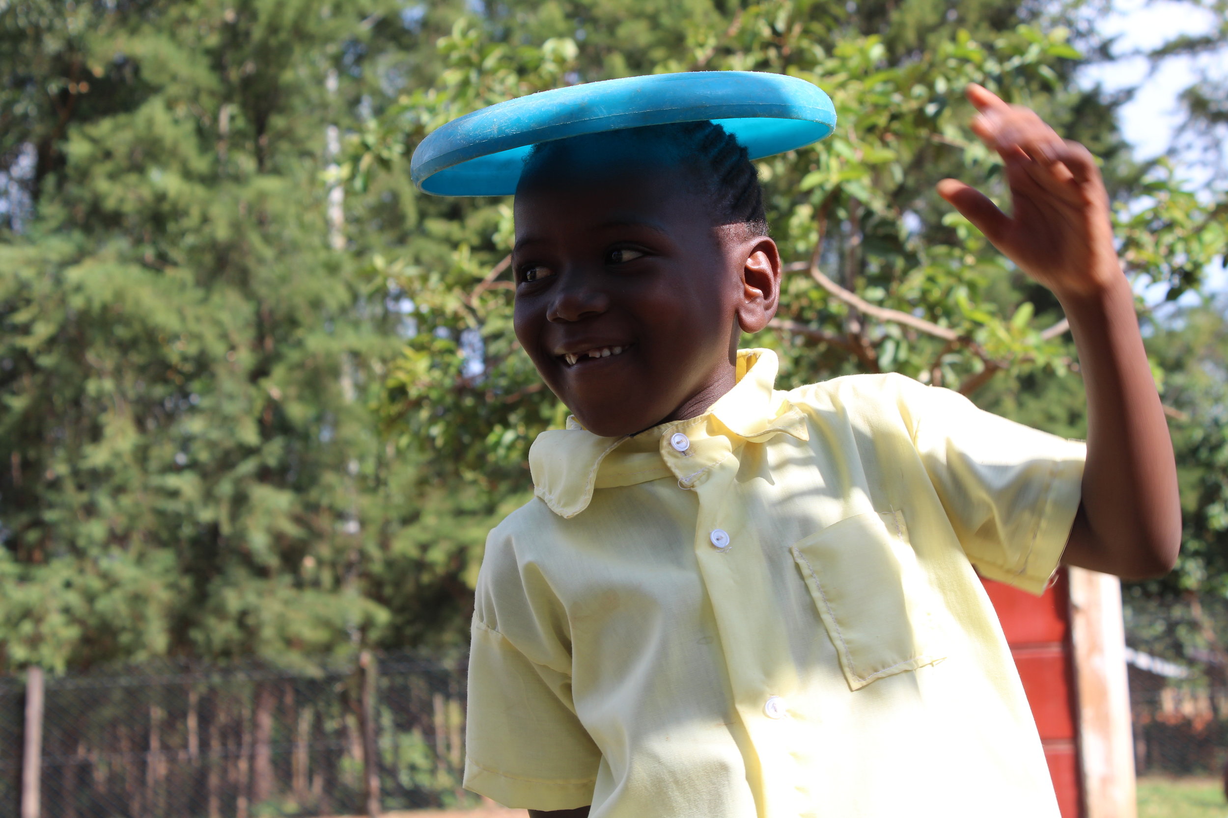  The Frisbees were a huge hit. Many of the students had never seen one before. Along with the fun of throwing them, some students found enjoyment by balancing them on their heads. 